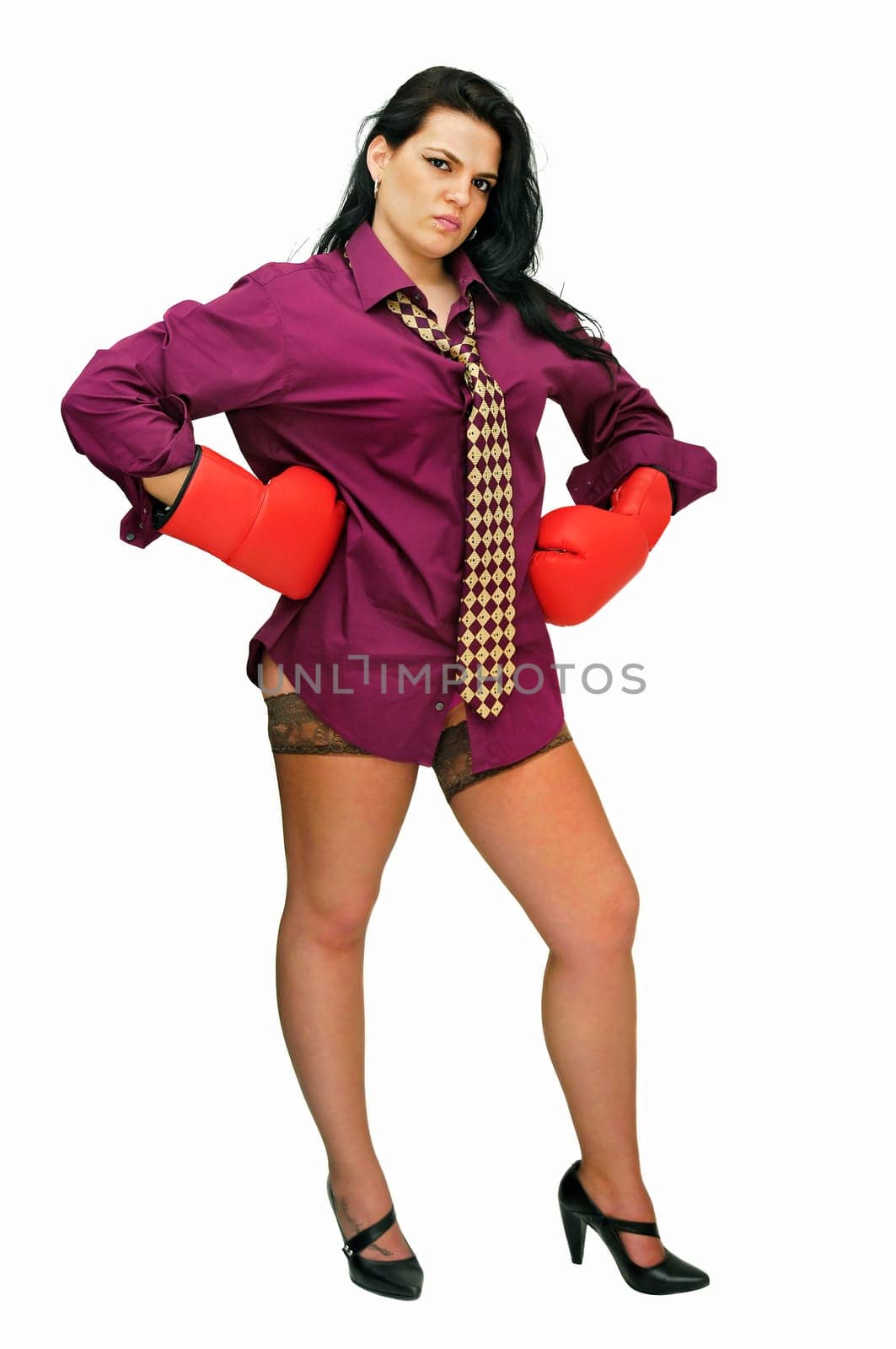 Sexy businesswoman with boxing gloves isolated in white