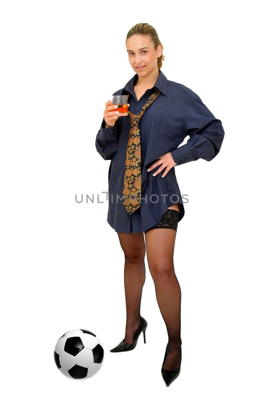 Sexy business girl with whiskey glass and soccer ball isolated in white