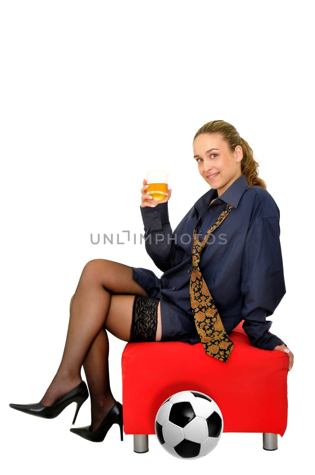 Sexy business girl with whiskey glass and soccer ball isolated in white