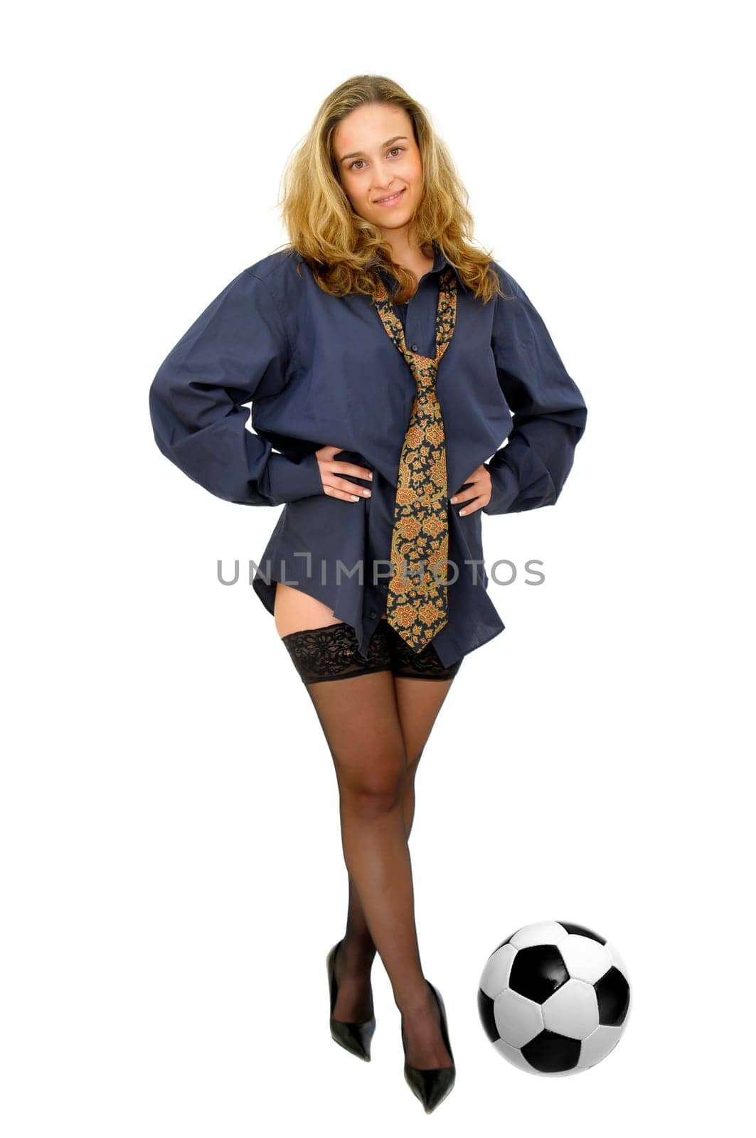 Sexy business girl with a soccer ball isolated in white