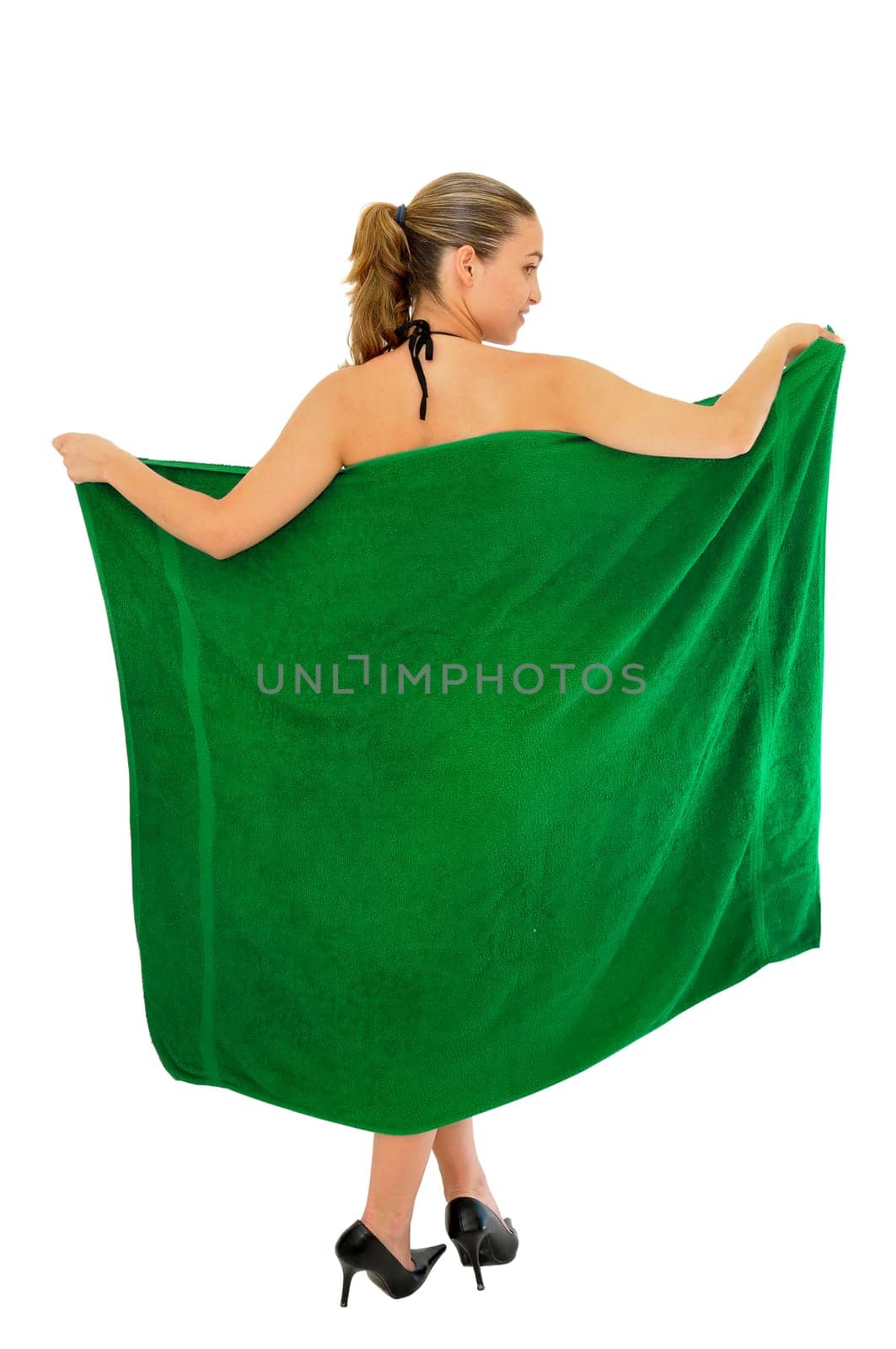 Sexy young girl with a colorful towel posing isolated in white