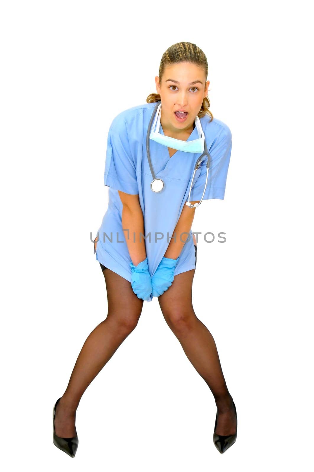 Sexy young doctor posing against a white background
