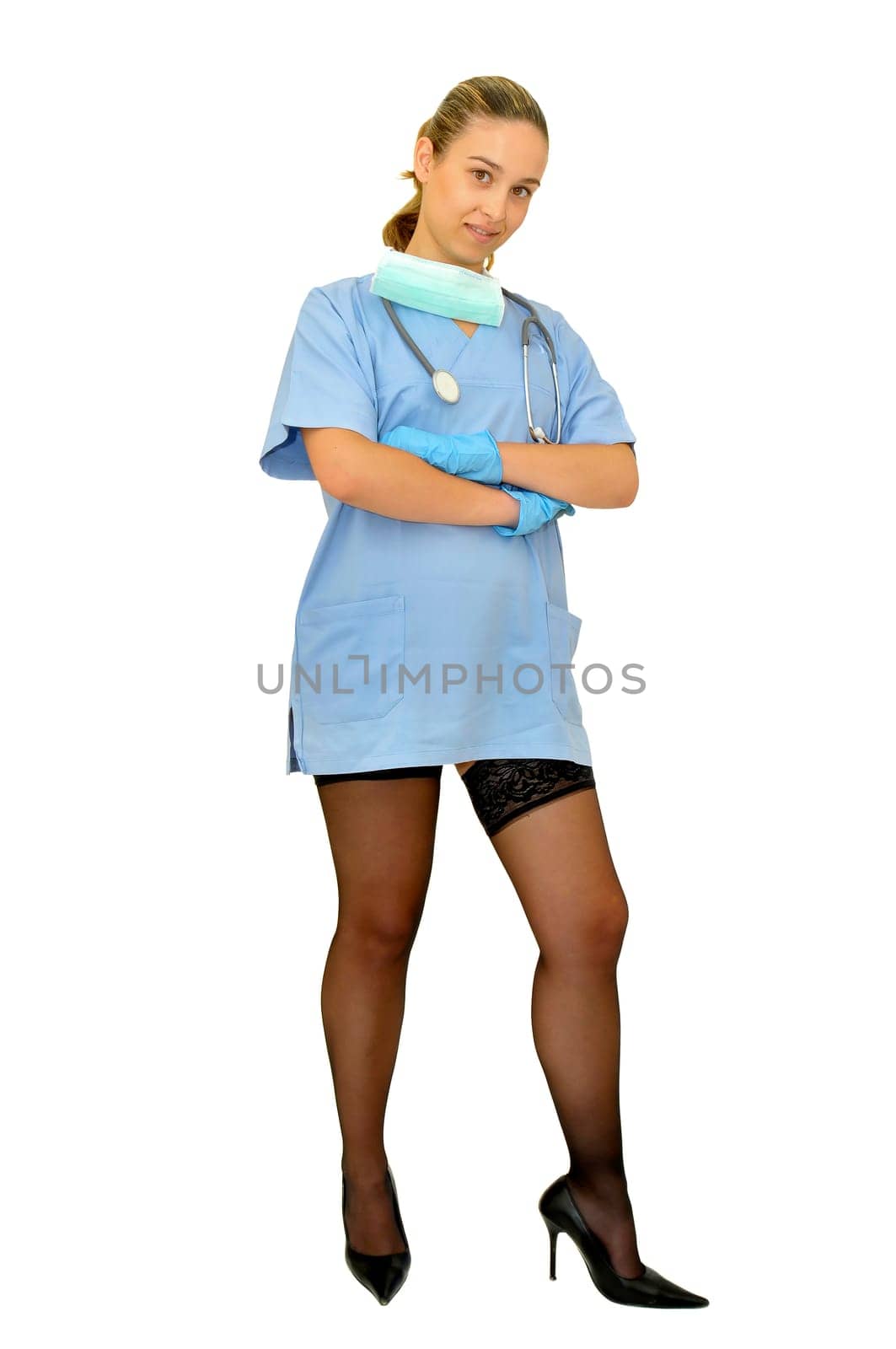 Sexy young doctor posing against a white background