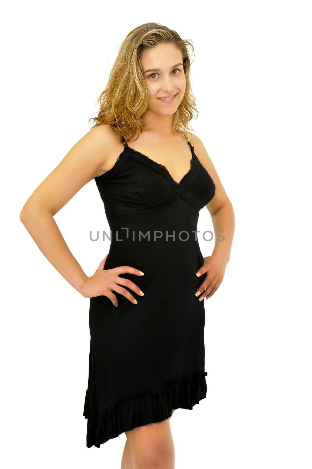 Beautiful young woman posing with a black dress isolated in white