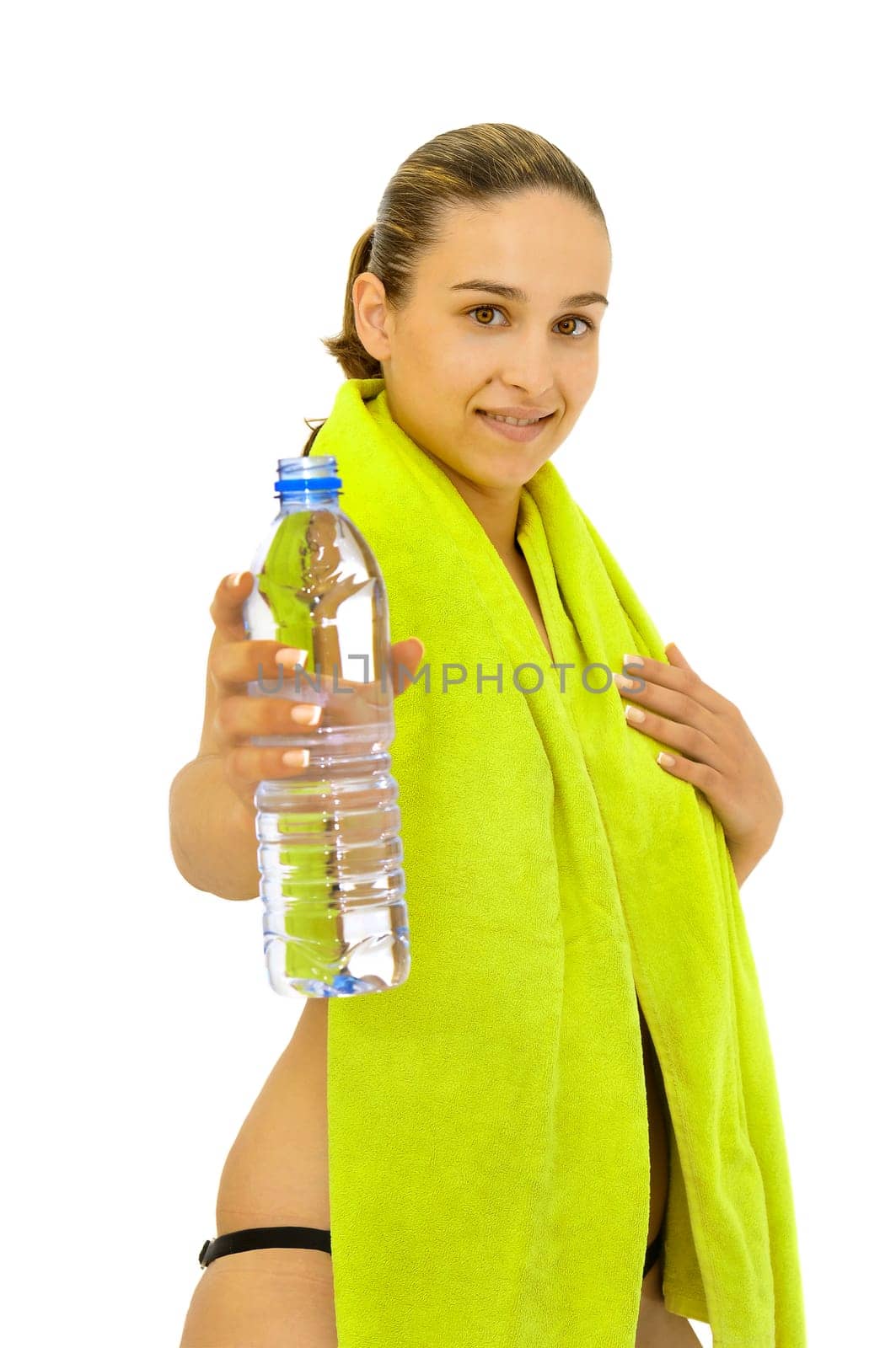 Sexy young girl with towel and water bottle isolated in white
