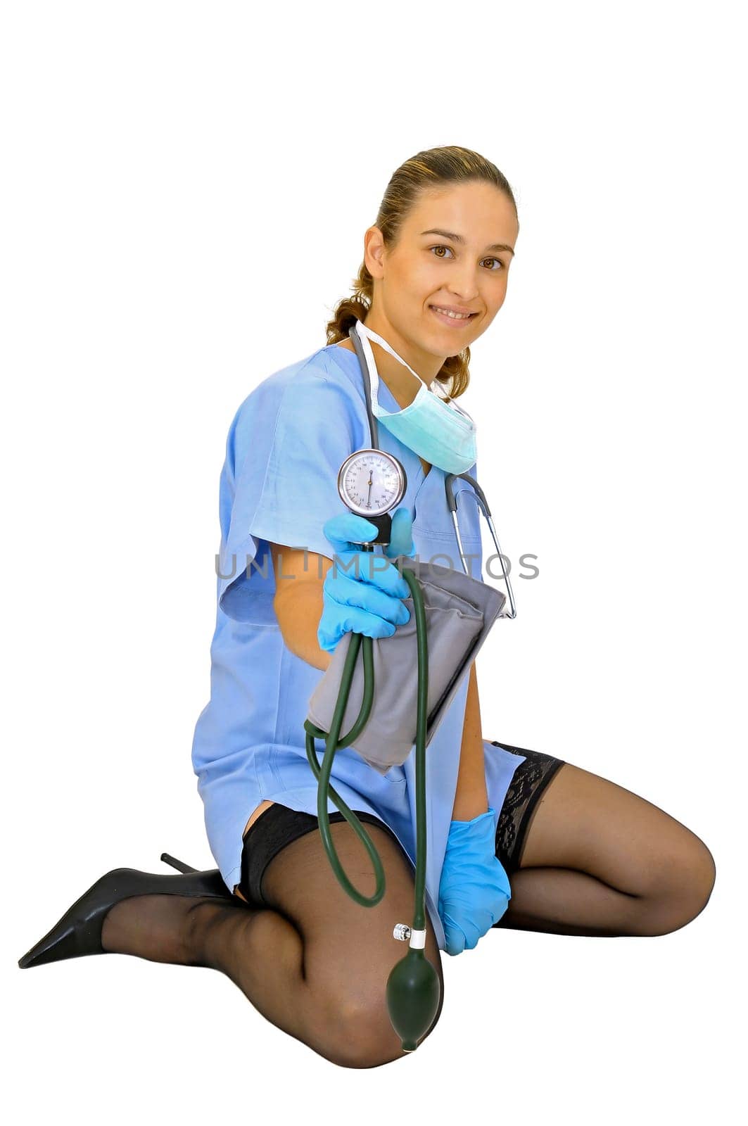 Sexy young doctor with blood pressure device posing against a white background
