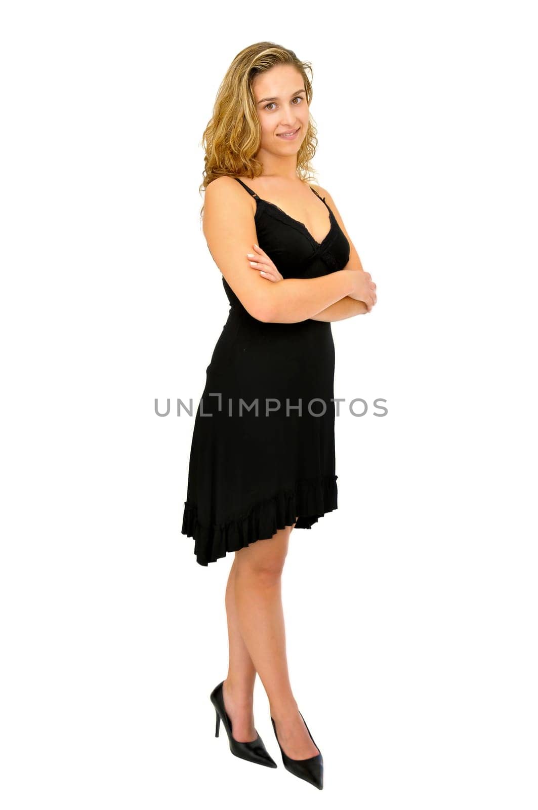 Beautiful young woman posing with a black dress isolated in white