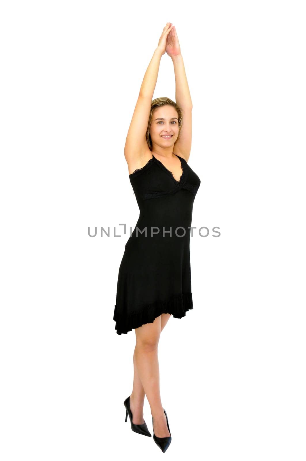 Beautiful young woman posing with a black dress isolated in white