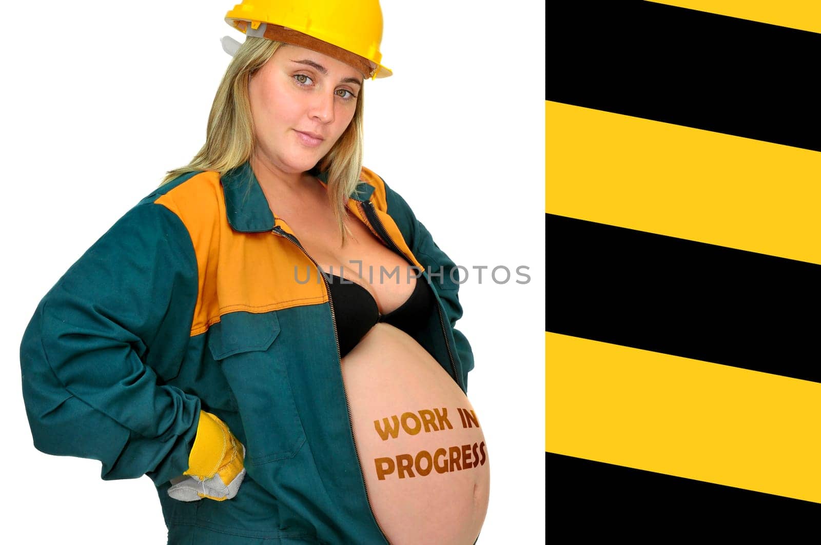 Pregnant woman in worker's jumpsuit isolated in white
