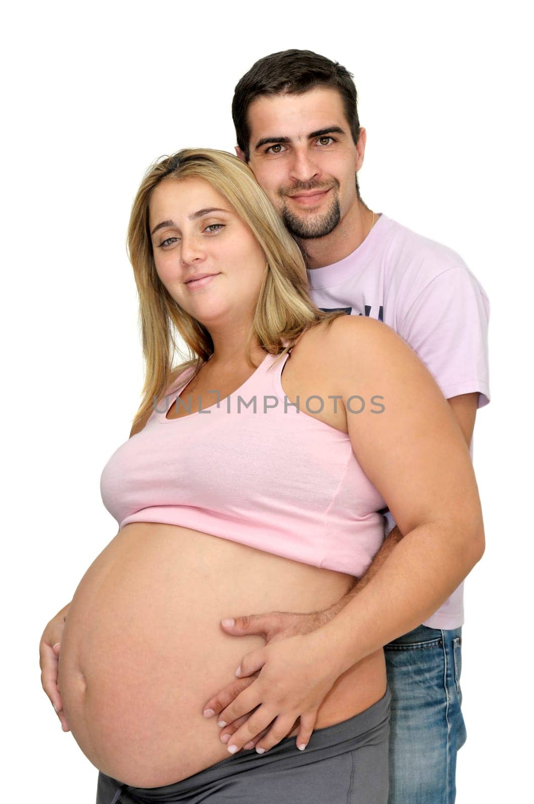 Happy pregnant couple isolated in white