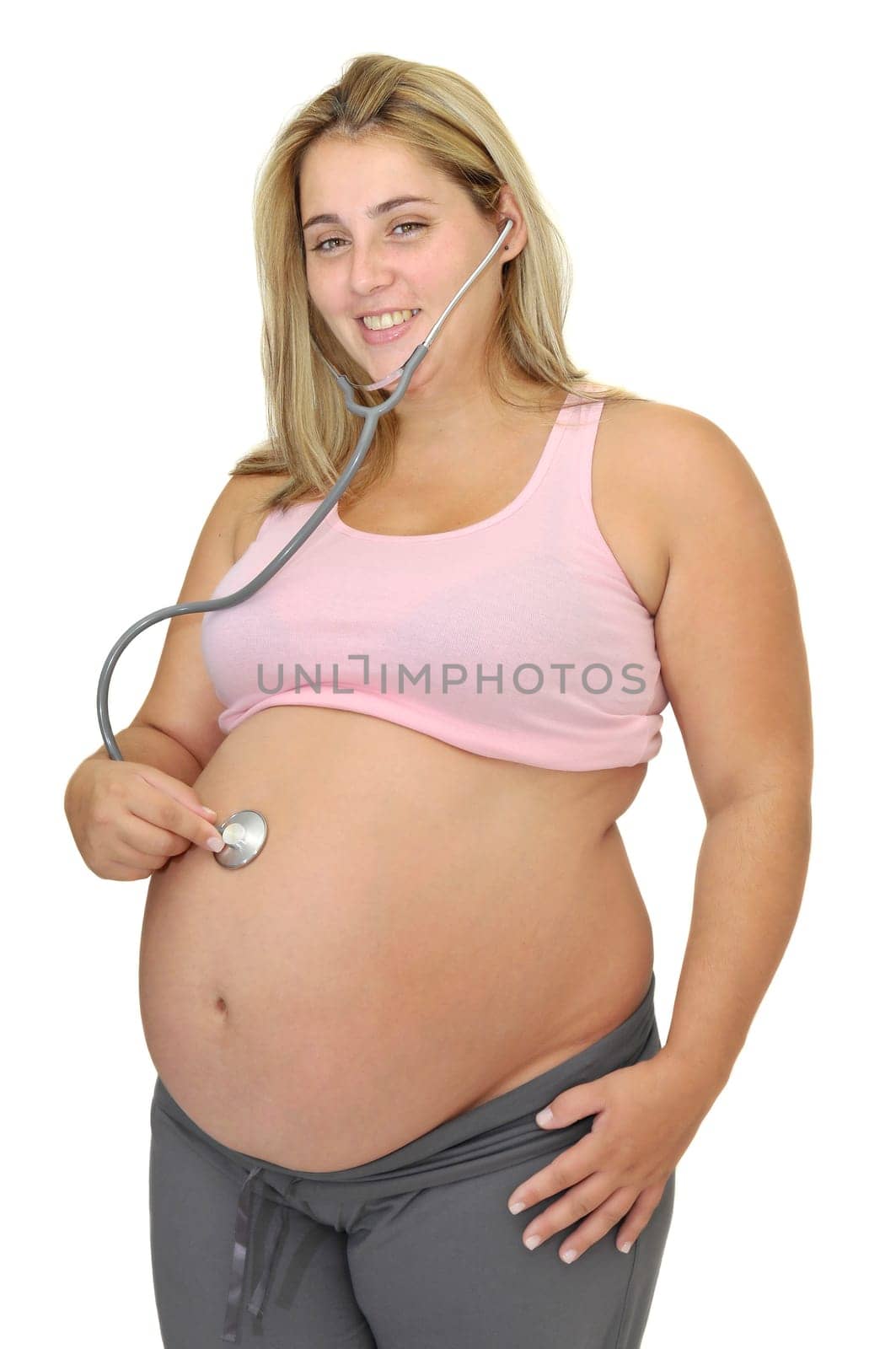 Pregnant woman with stethoscope isolated in white