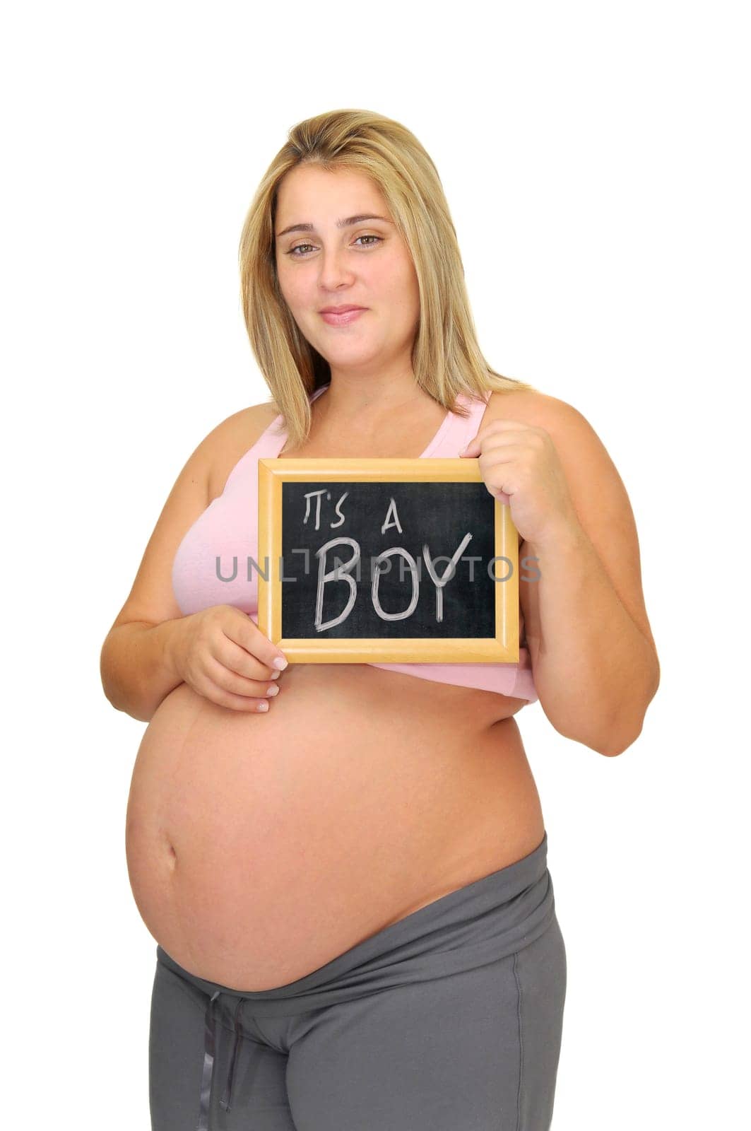 Pregnant woman holding a frame isolated in white