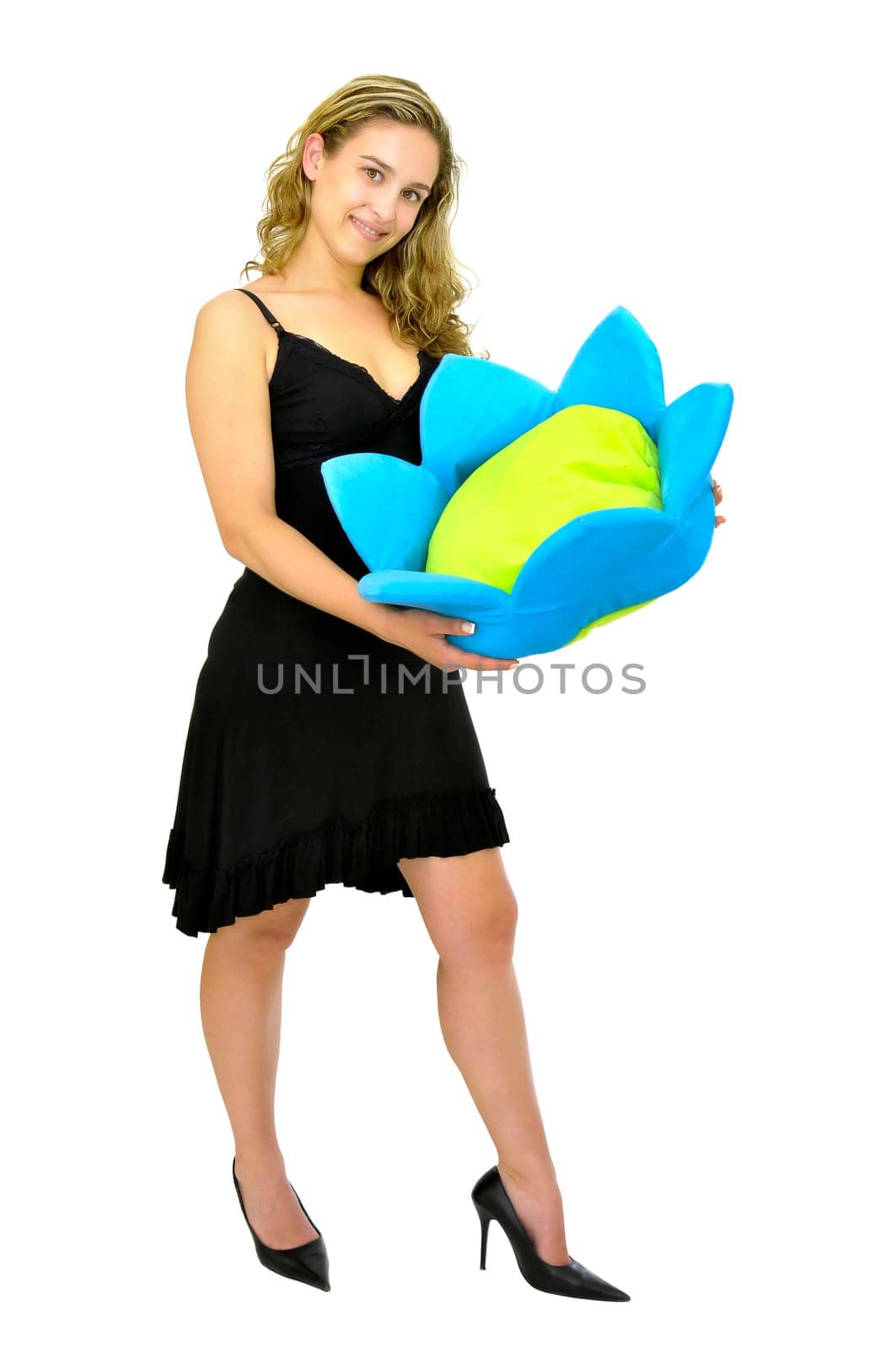Beautiful young woman posing with a black dress and a flower isolated in white