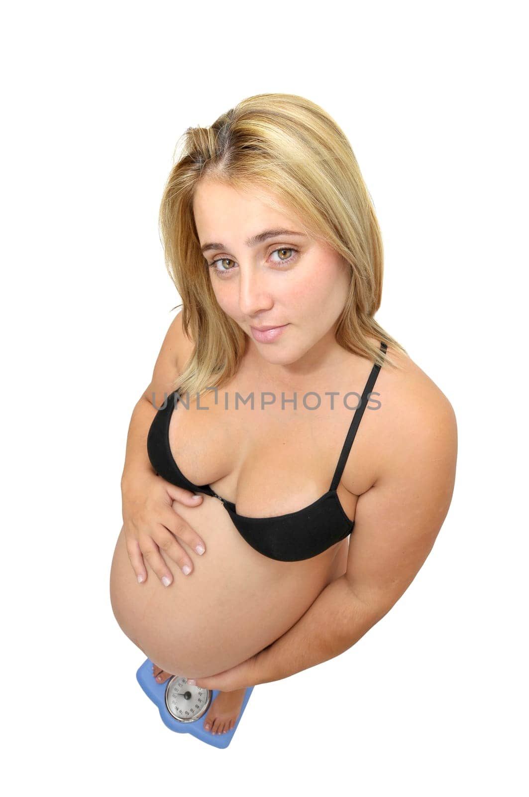 Pregnant woman in a weight scale