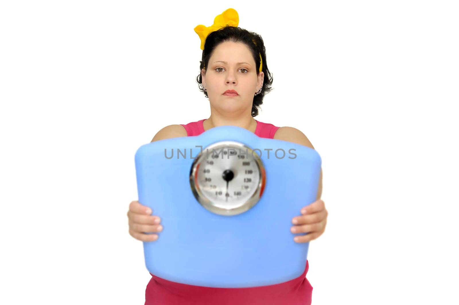 Large girl holding a scale isolated in white