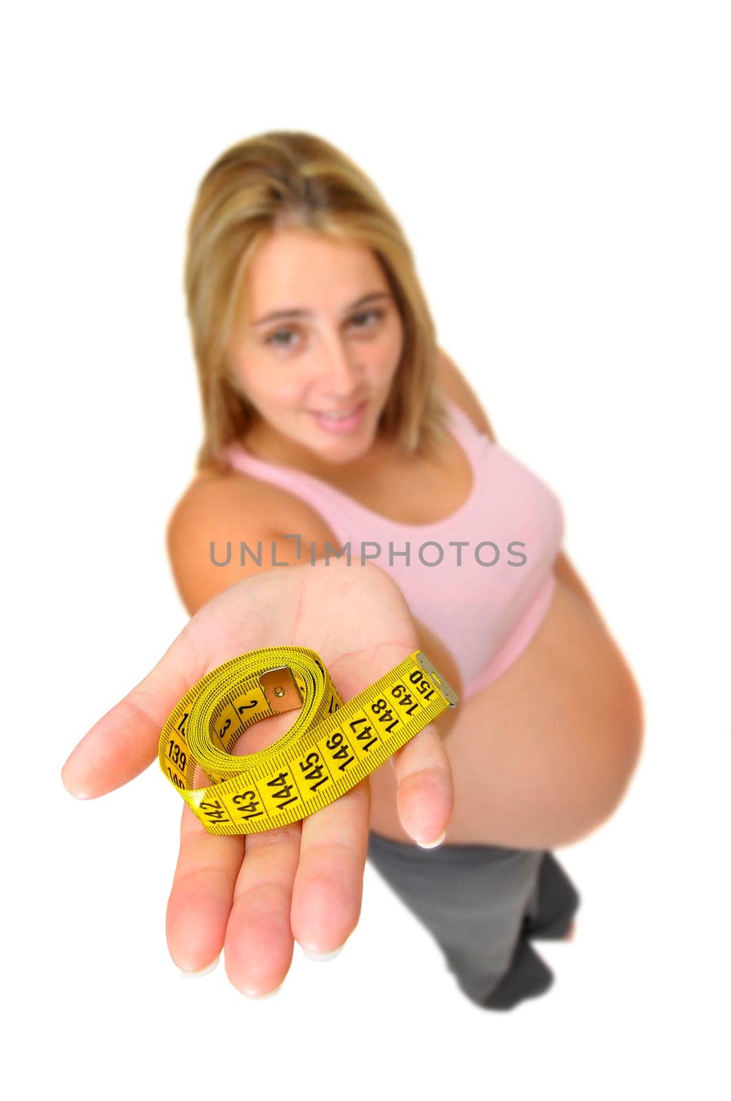 Pregnant woman with measuring tape isolated in white