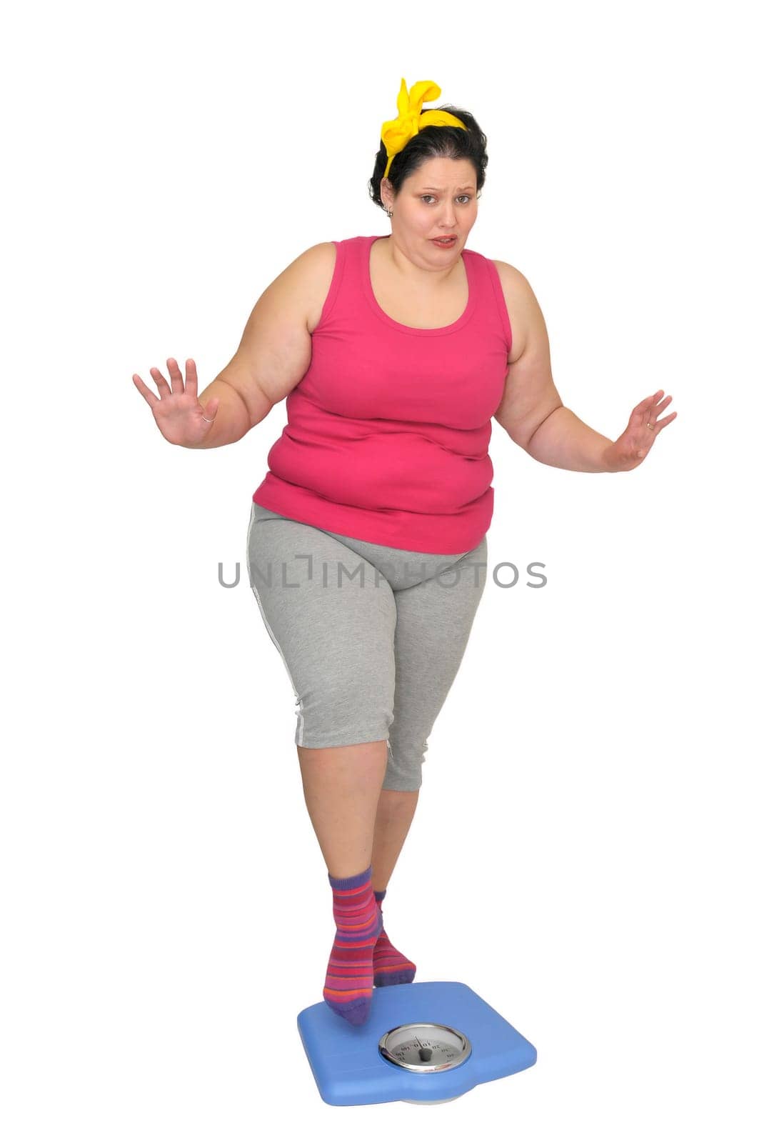 Large girl holding a scale isolated in white