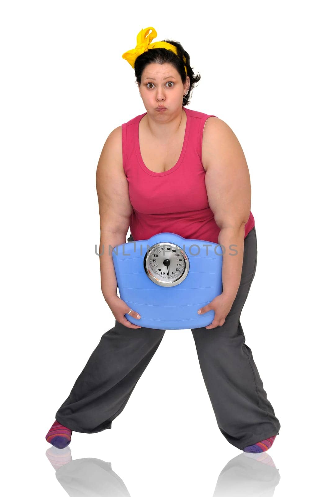 Large girl holding a scale isolated in white
