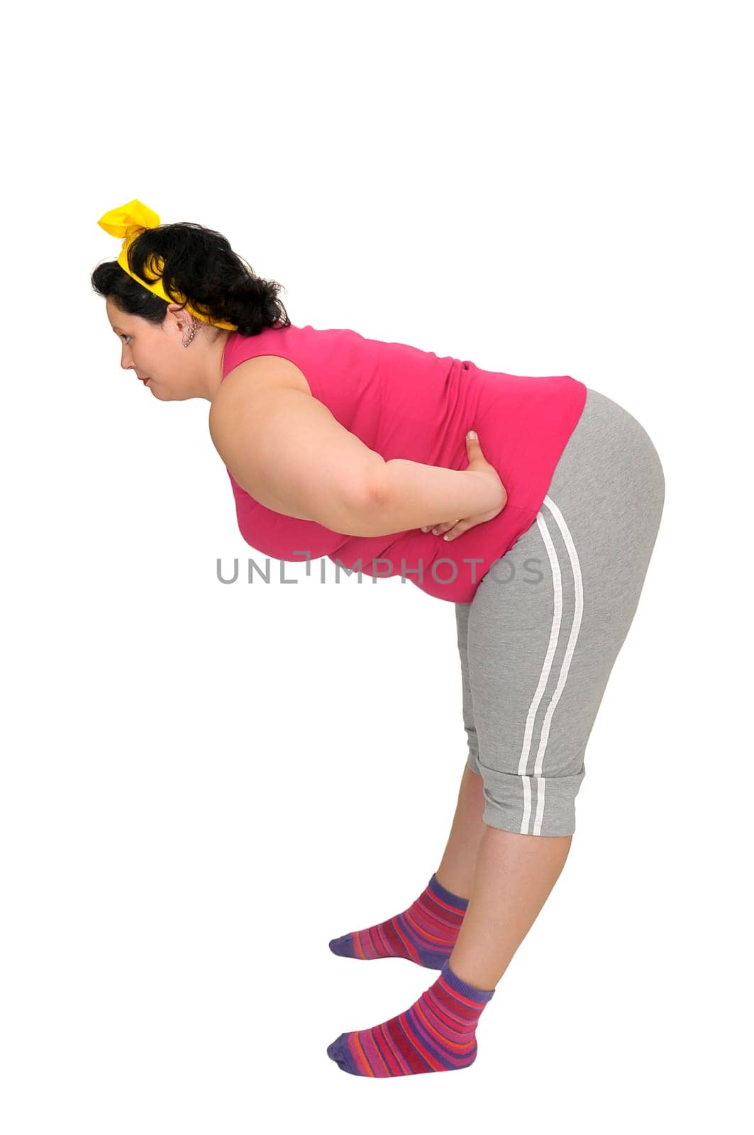 Large girl doing fitness exercises isolated in white