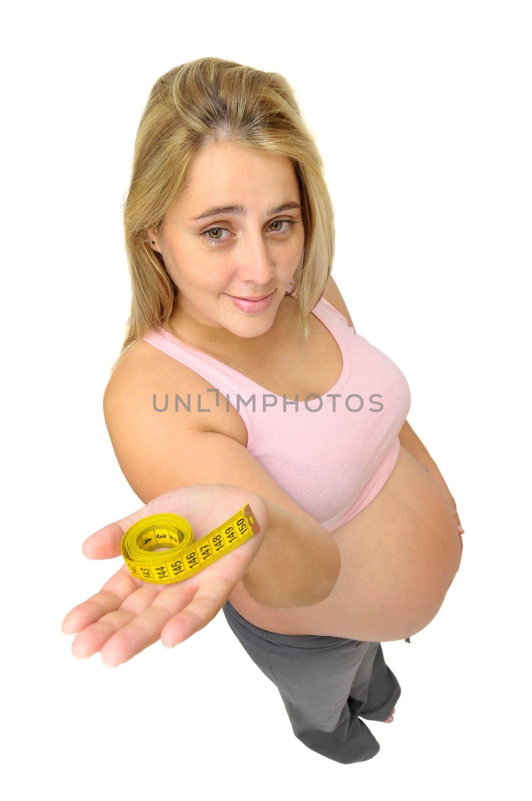 Pregnant woman with measuring tape isolated in white