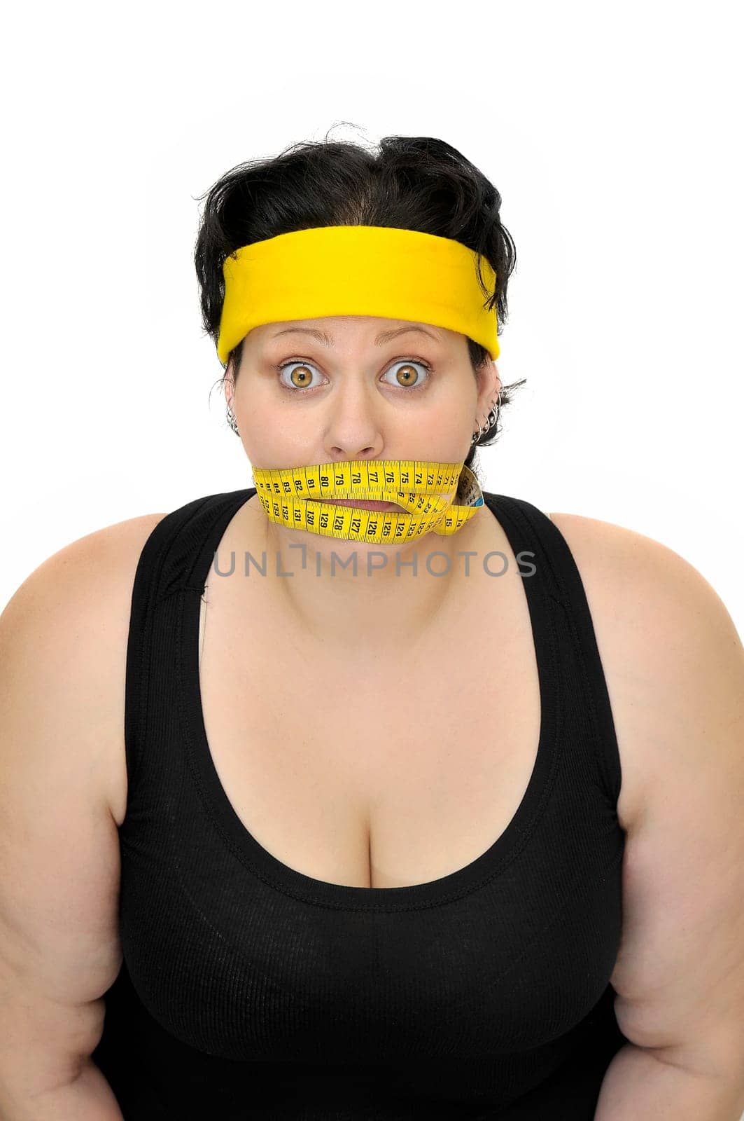 Large girl with measuring tape around her mouth
