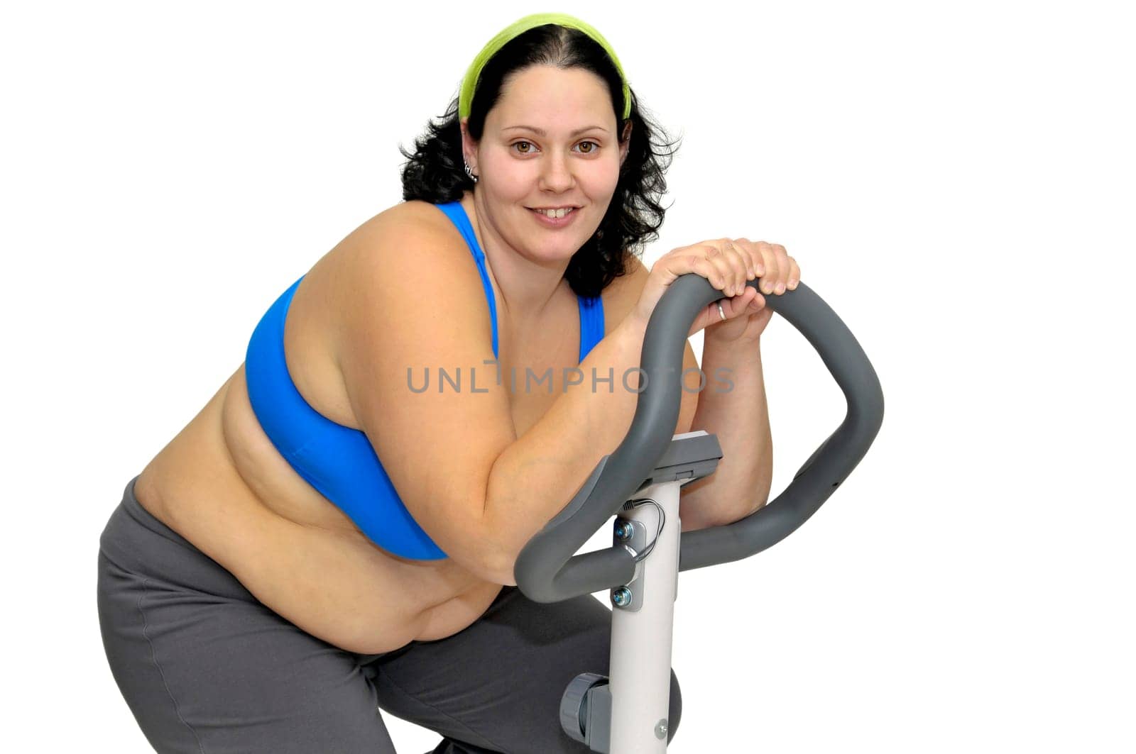 Large girl exercising isolated in white