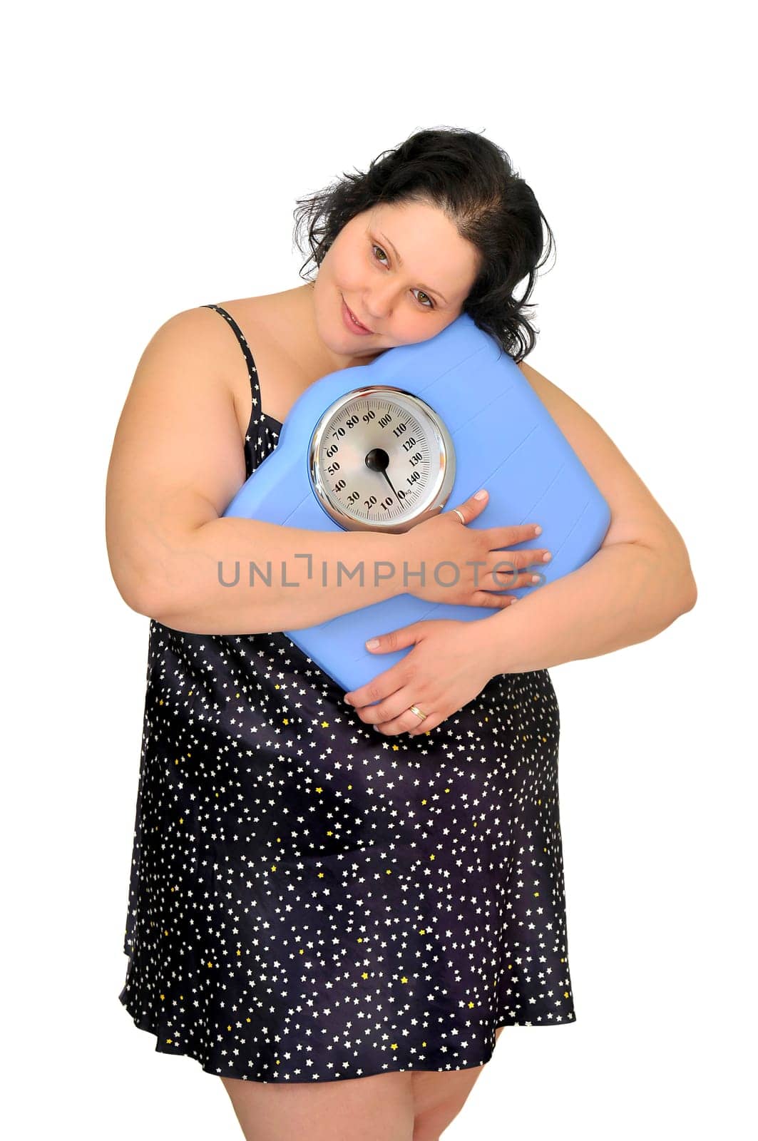 Large girl in nightie holding a scale isolated in white