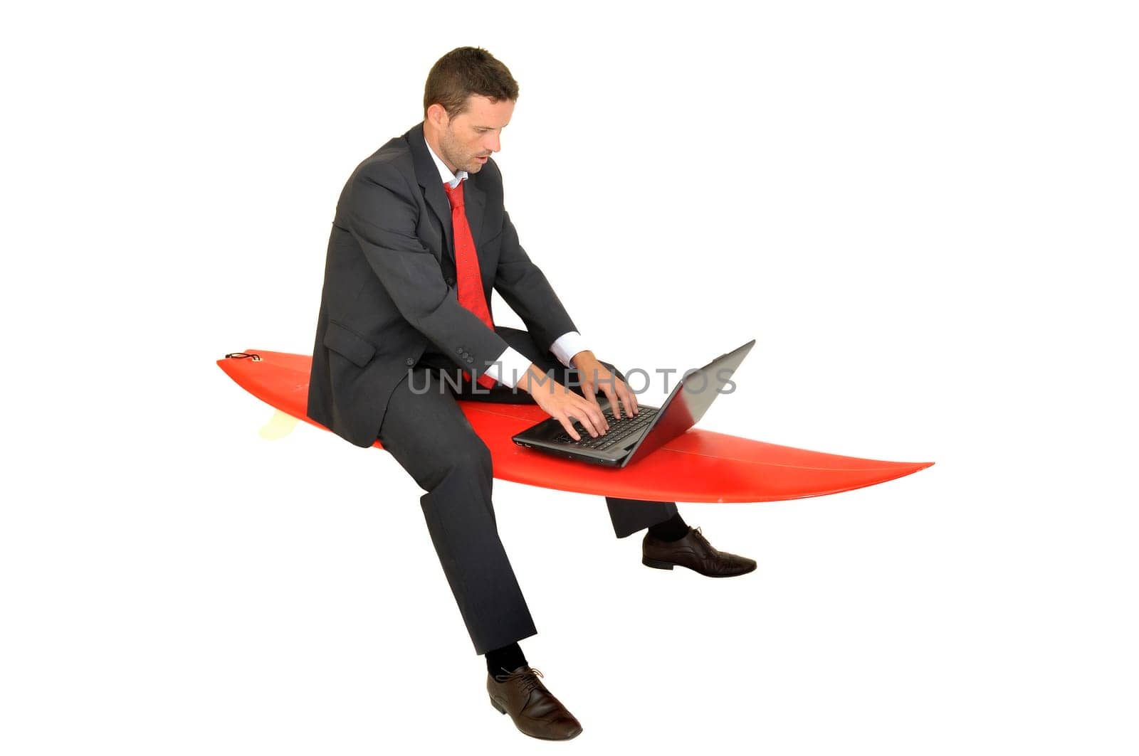 Young businessman with surf board