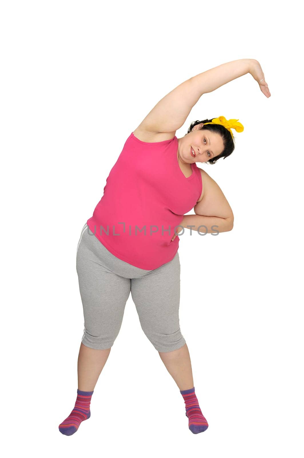 Large girl doing fitness exercises isolated in white