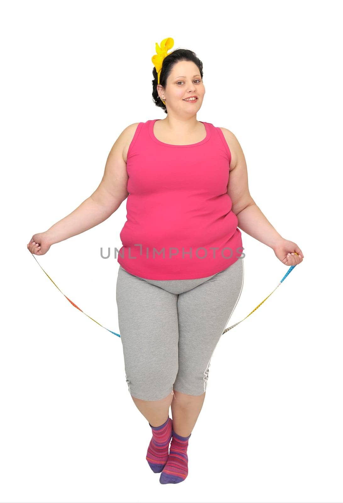 Large girl doing fitness exercises isolated in white