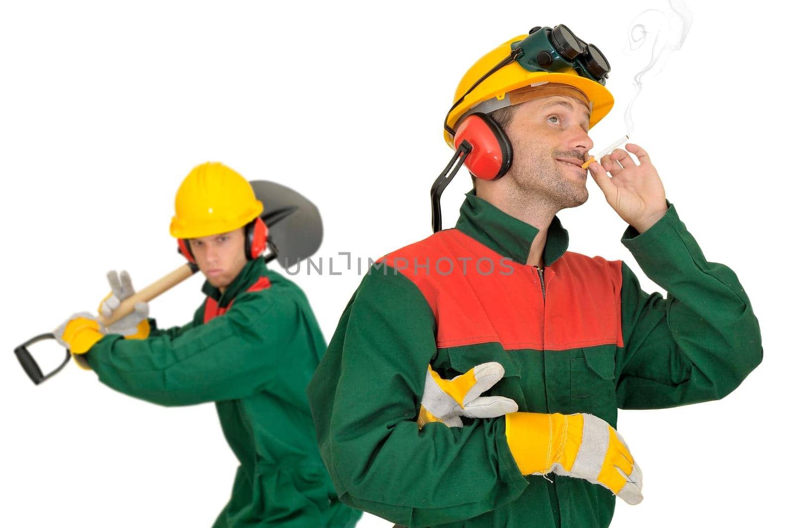 Smoking worker and angry team mate with shovel