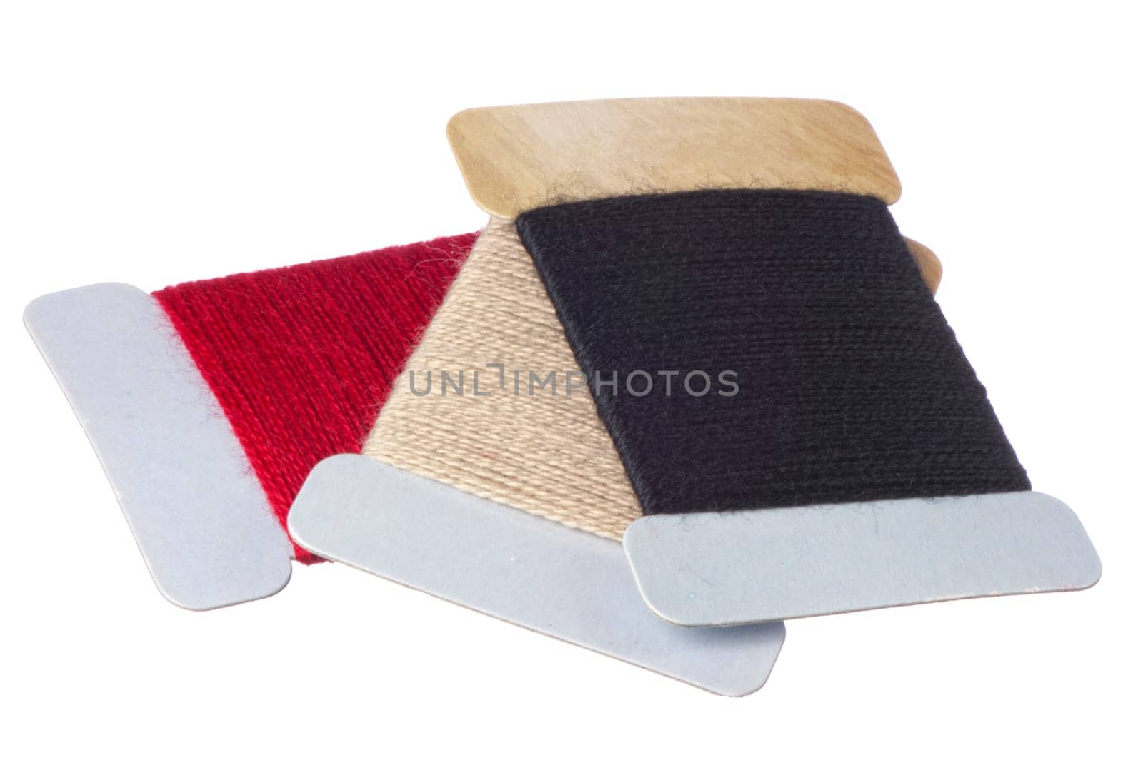 a few strands of darning colored on white background