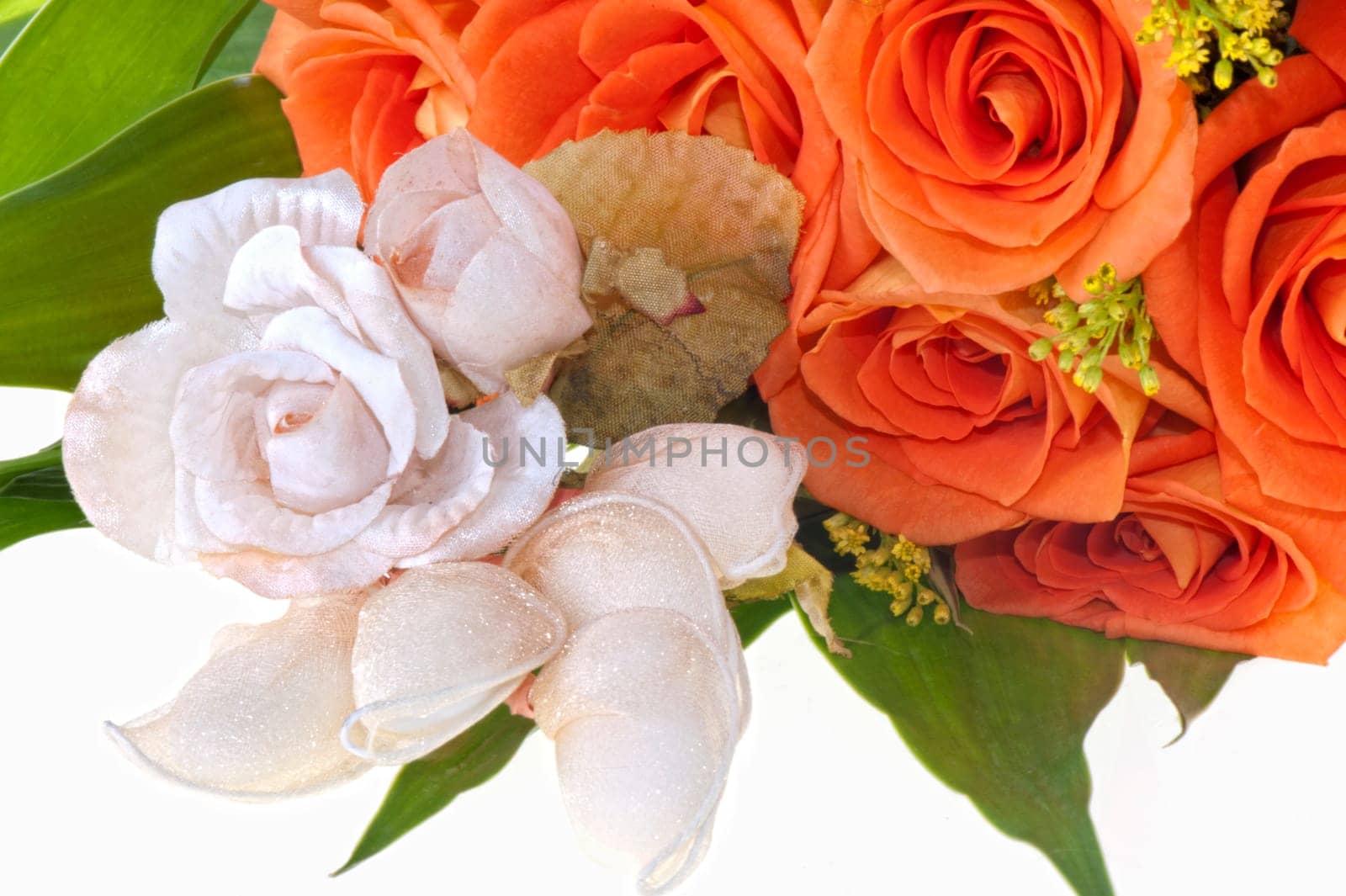 weeding Favors and orange roses on white lace