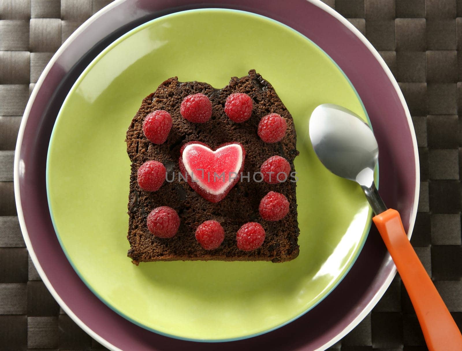 Lovely raspberryes and heart cake. Valentine. Brown bread