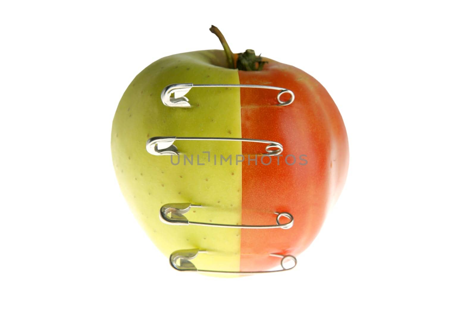 Genetic fruit manipulation metaphor with apple and tomato