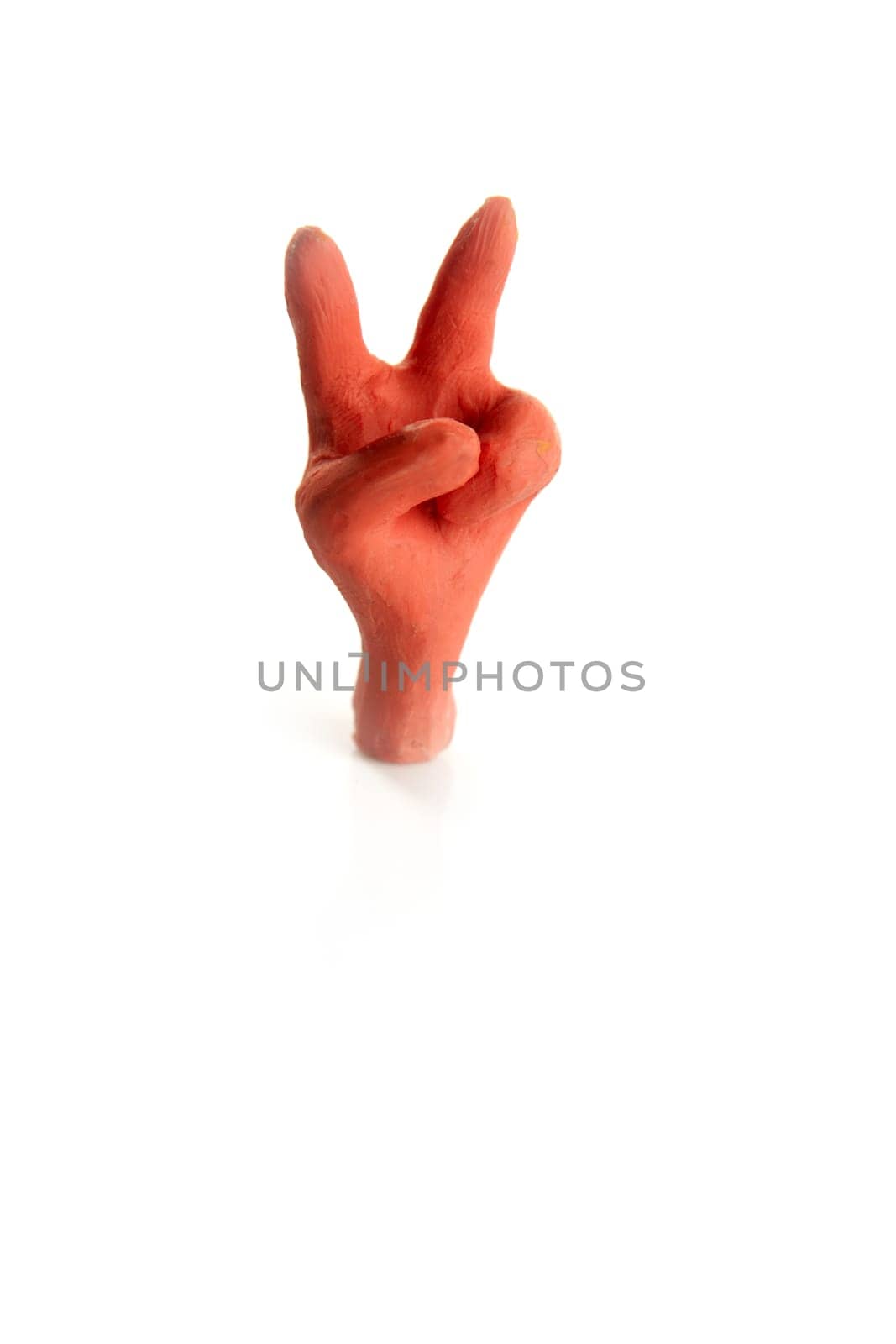 Winner two finger plasticine hand, handmade isolated on white