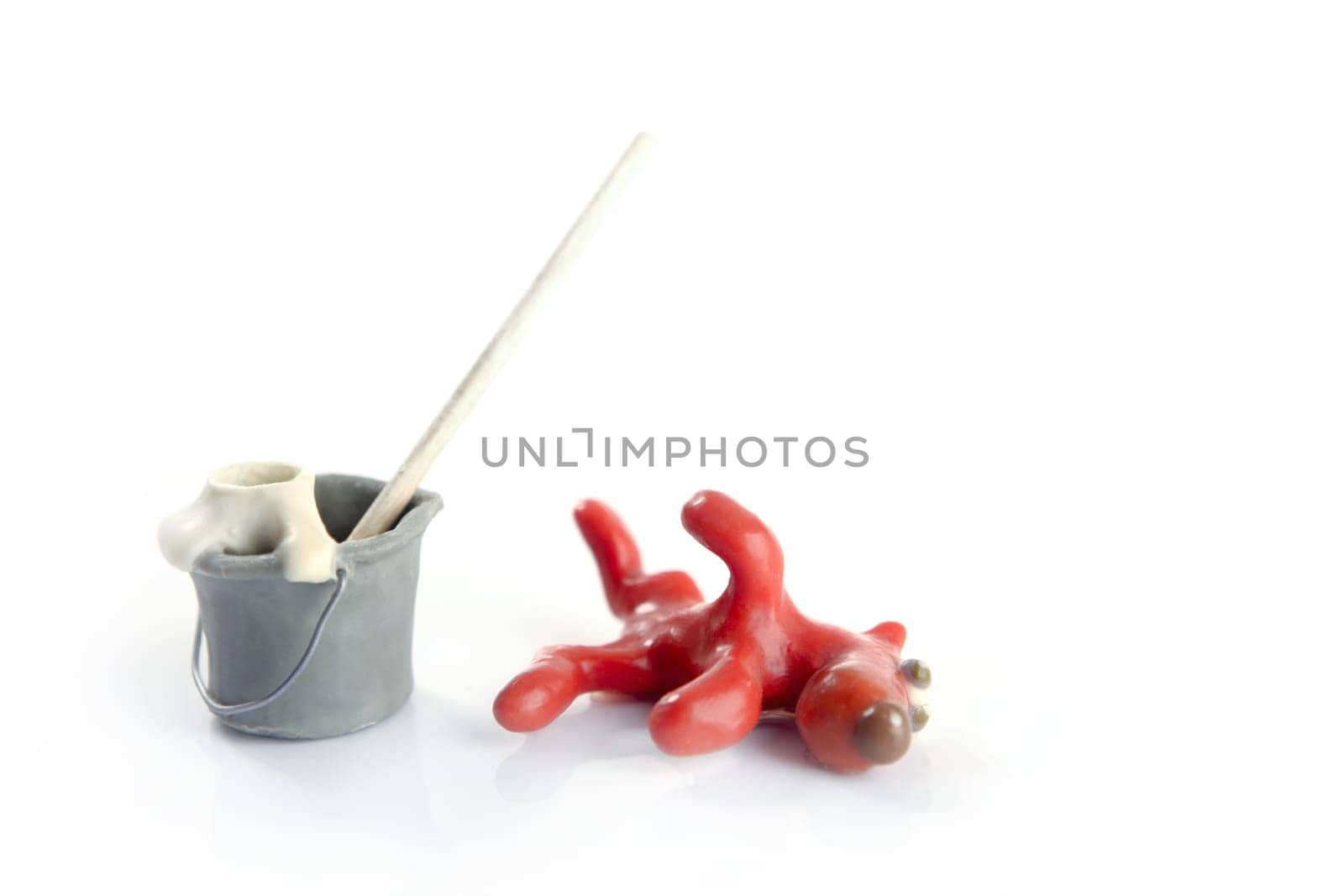 Lazy handmade plasticine housekeeping dog, funny, isolated on white