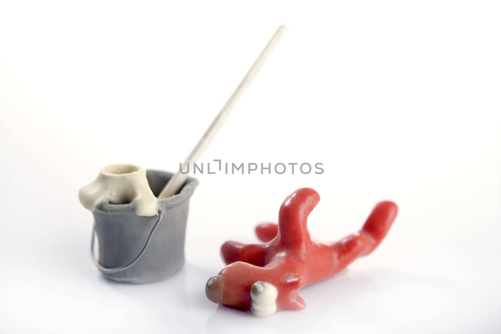 Lazy handmade plasticine housekeeping dog, funny, isolated on white