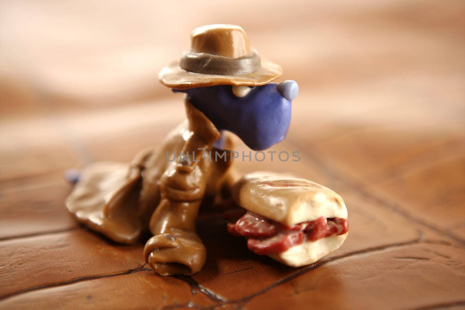 Handmade hungry plasticine dogs withy some meat to eat