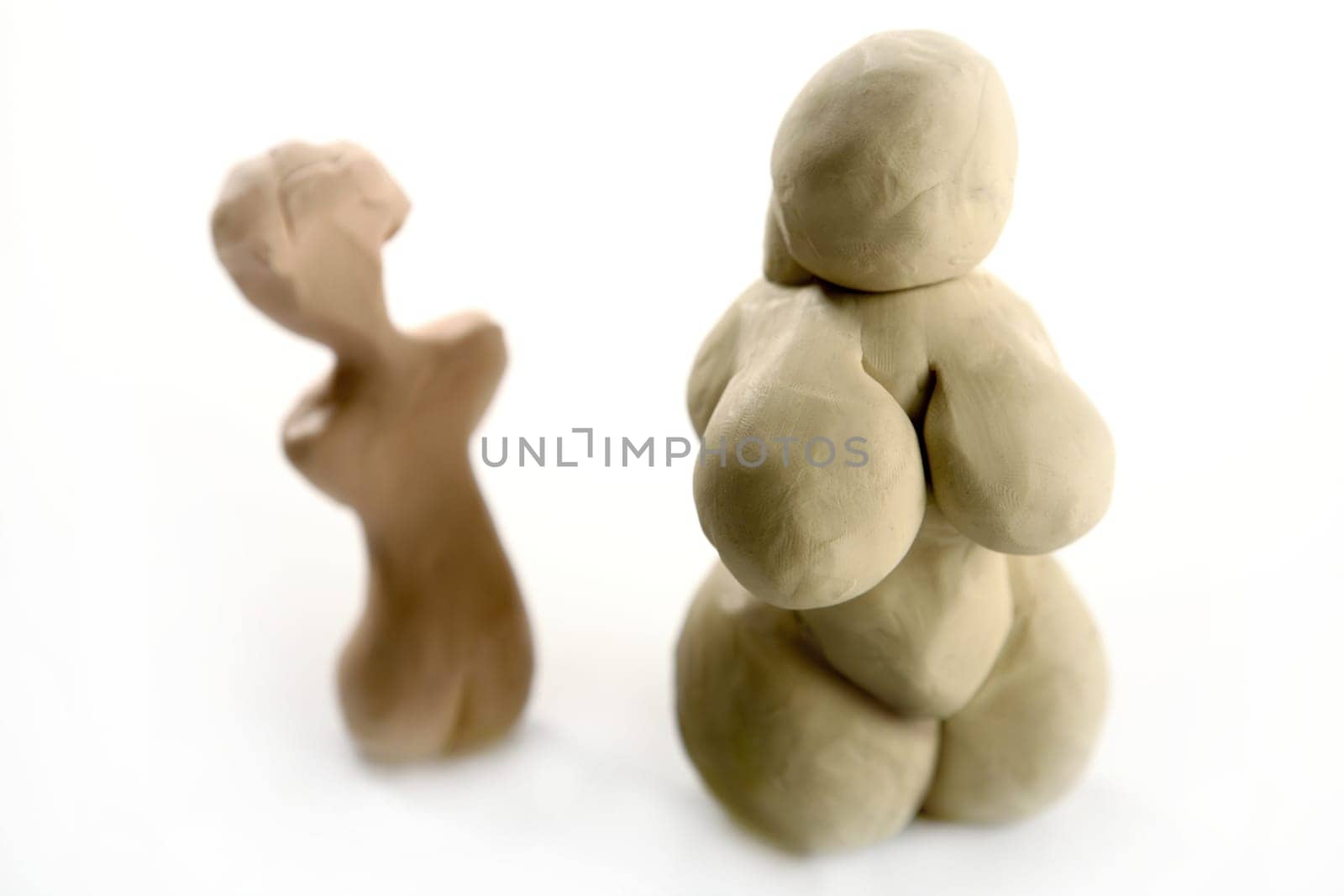 Fat woman handmade plasticine figurine isolated on white