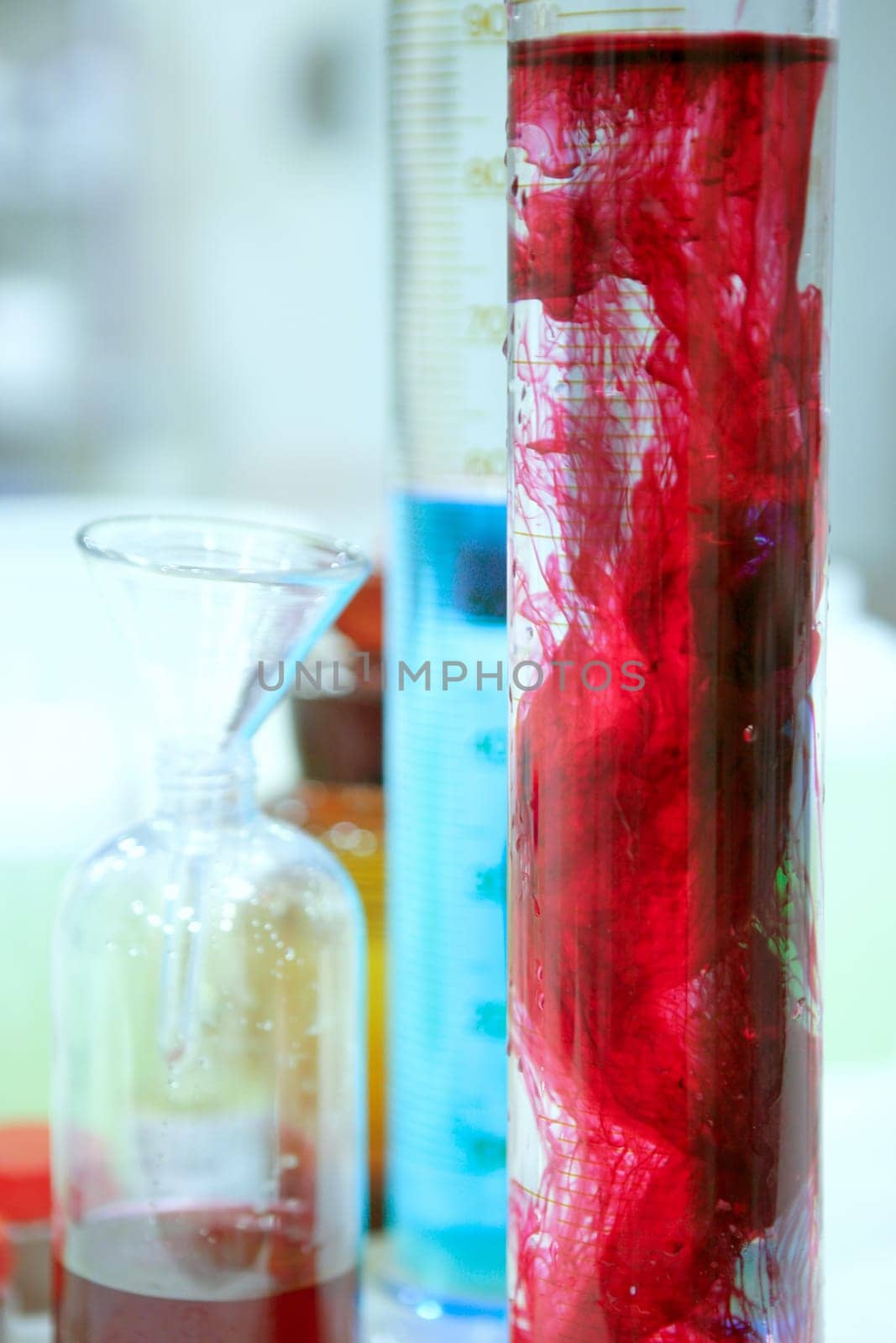 Laboratory stuff, glass cylinder vases, colorful liquids, chemical research