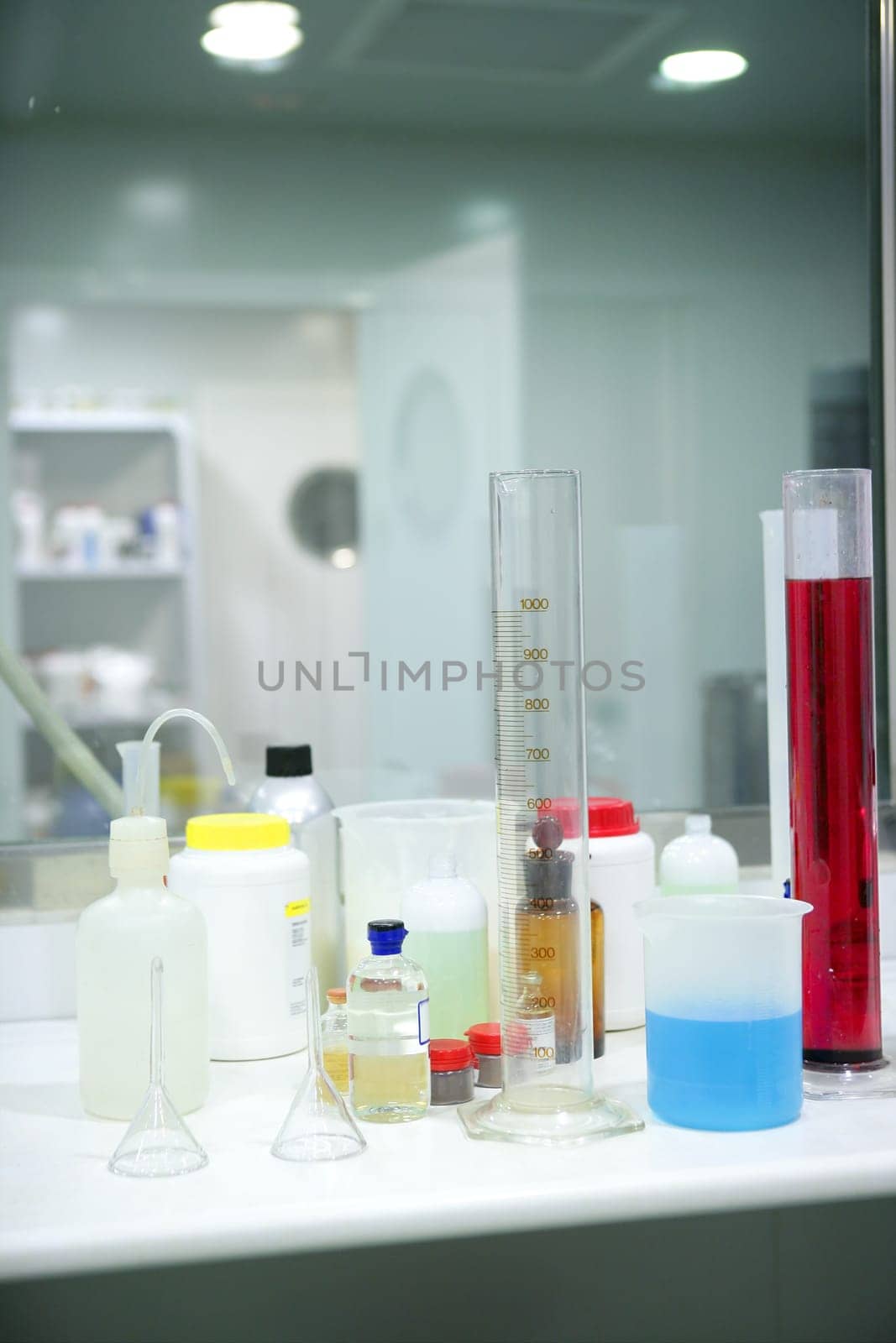 Laboratory stuff, glass cylinder vases, colorful liquids, chemical research