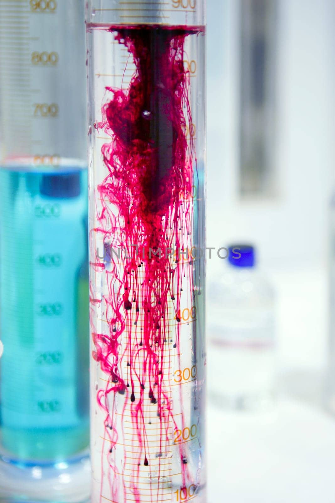 Laboratory stuff, glass cylinder vases, colorful liquids, chemical research