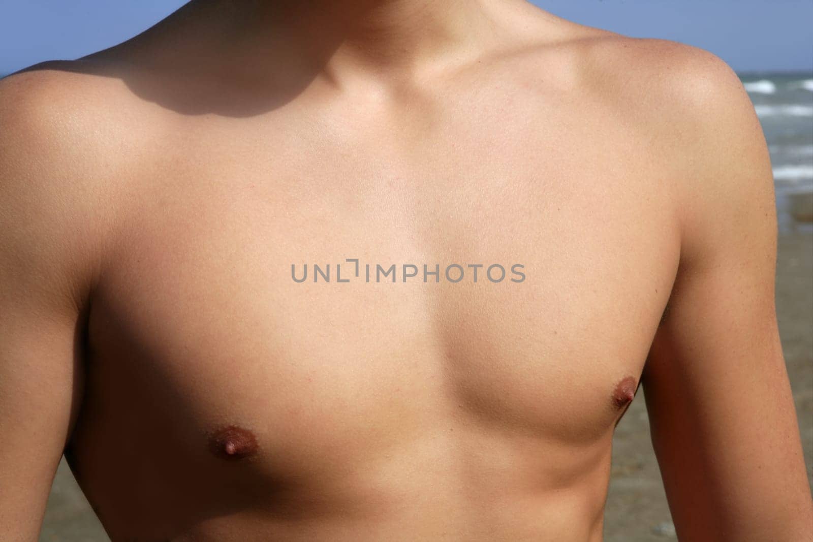 man torso closeup crop outdoor in the beach
