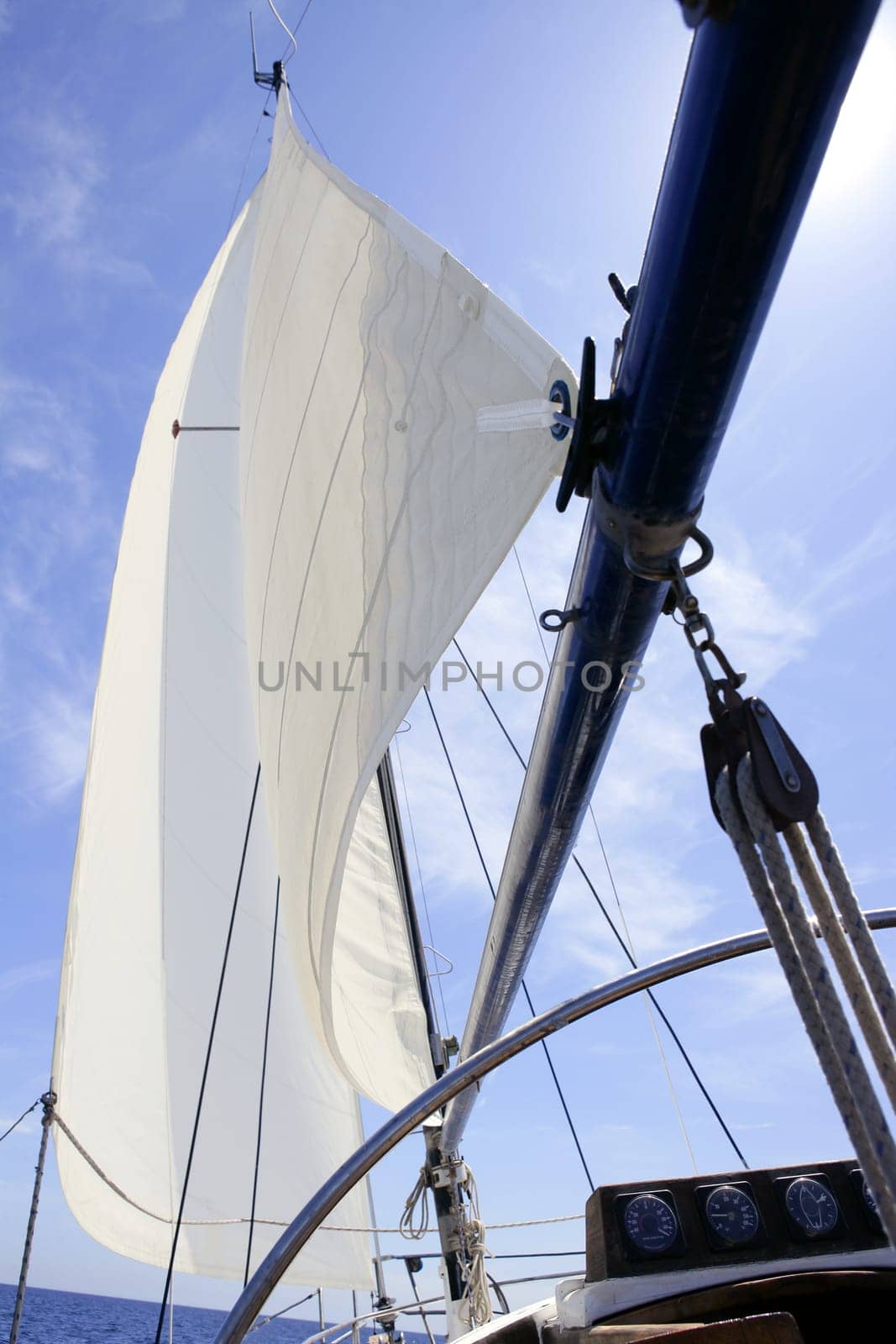 Sailboat sailing blue sea on sunny summer day in Mediterranean