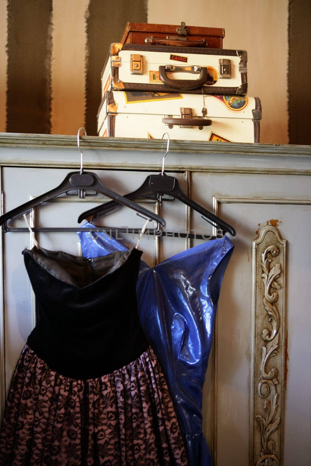 Old suitcases over the wardrobe, vintage style