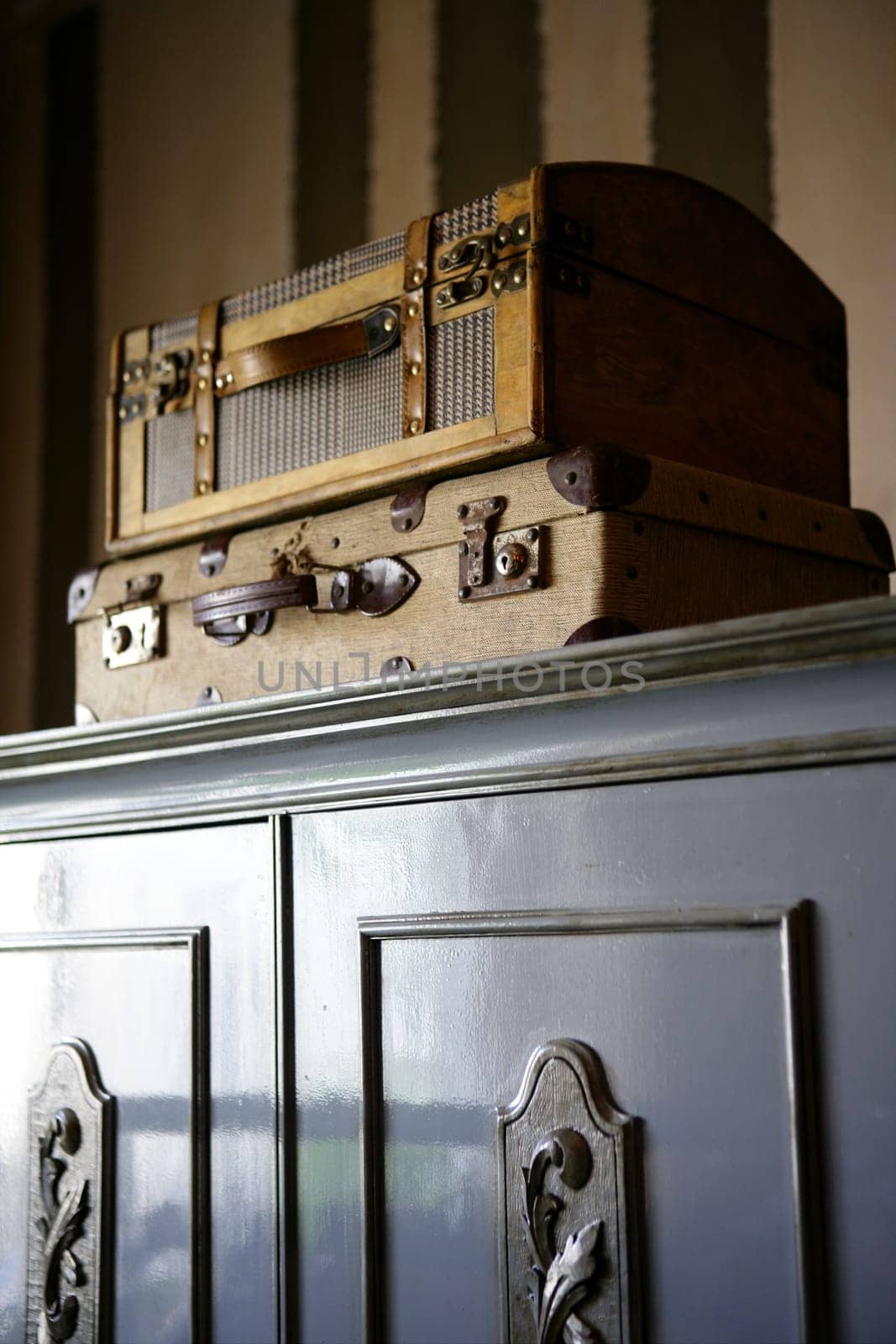 Old suitcases over the wardrobe, vintage style