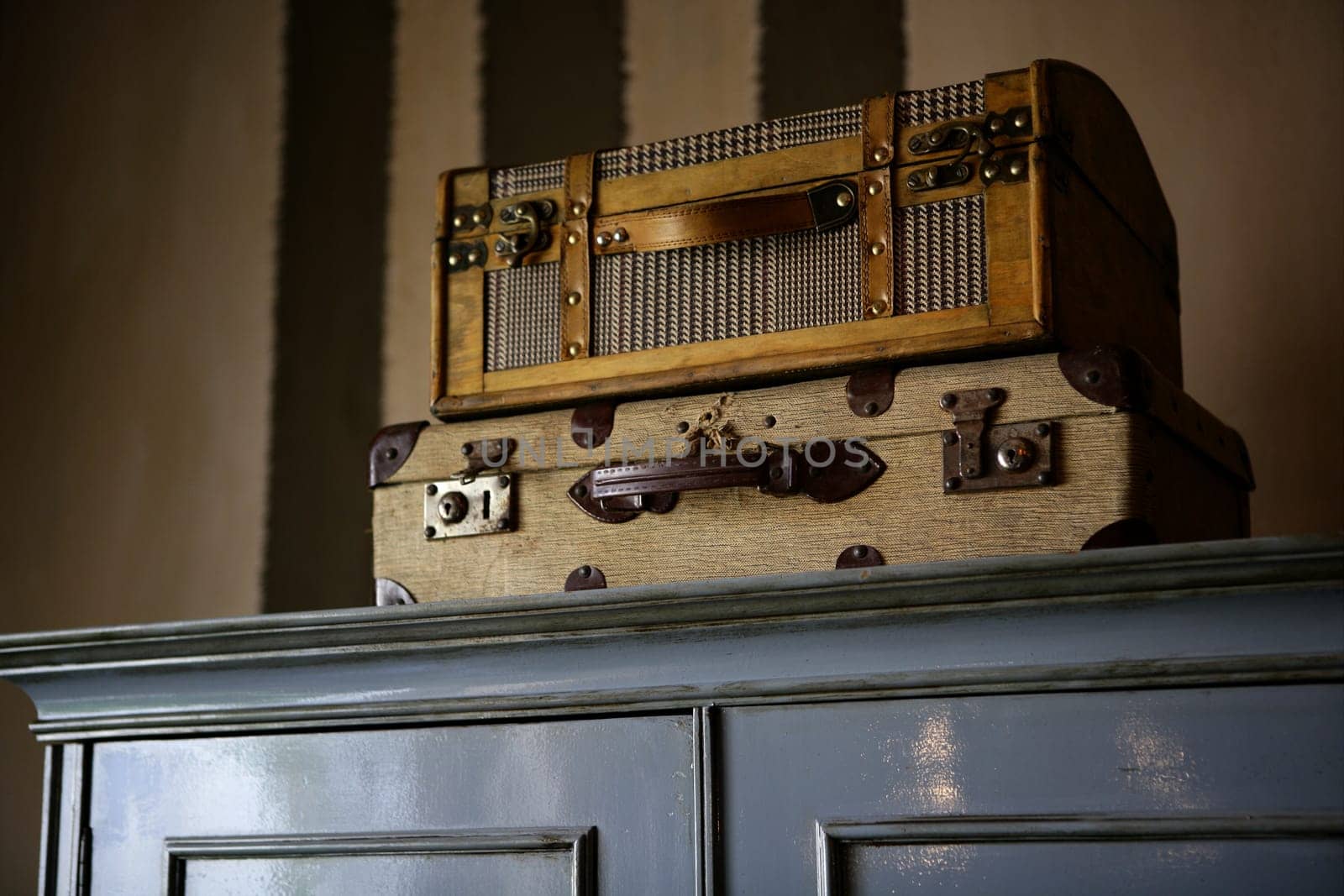 Old suitcases over the wardrobe, vintage style