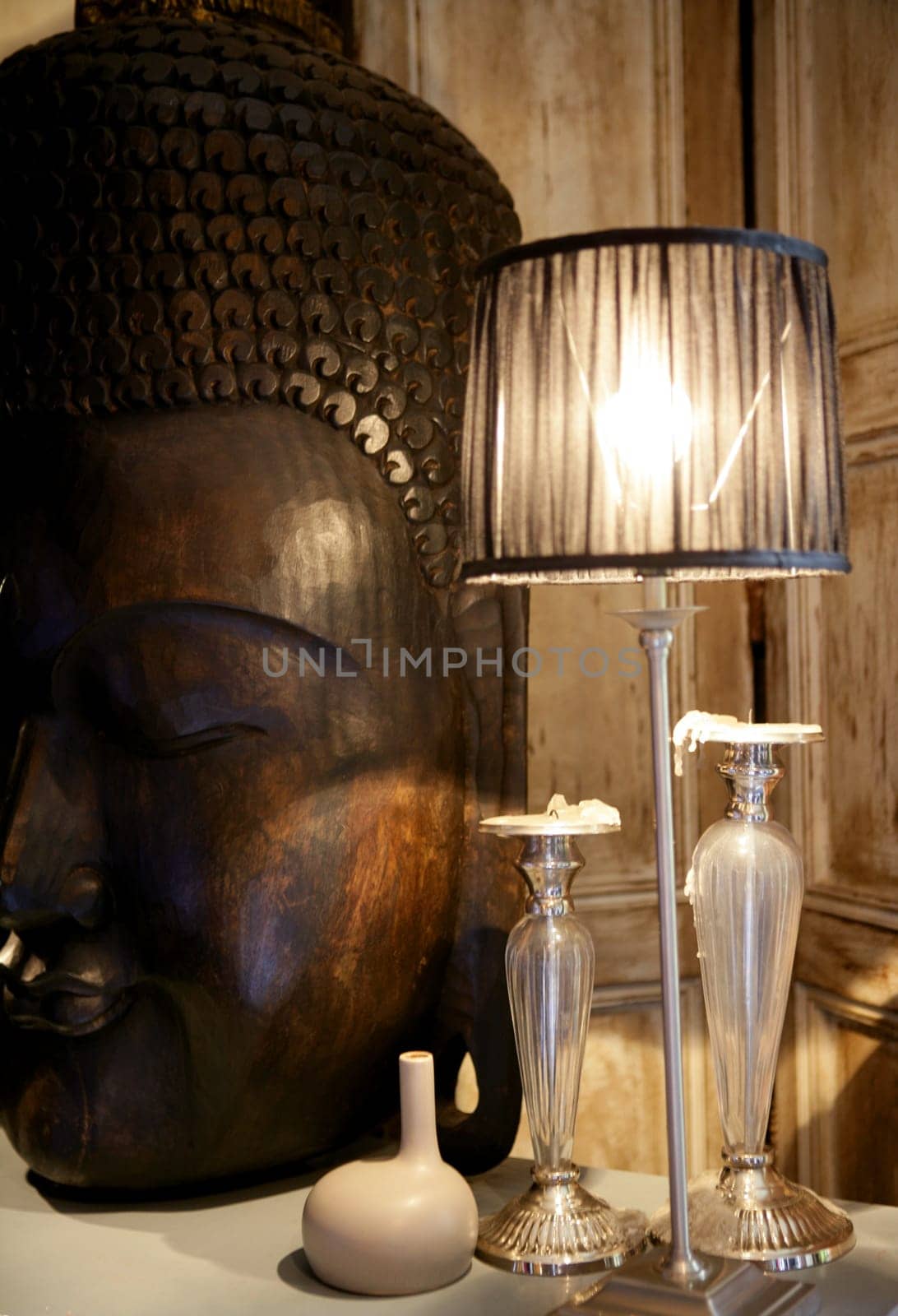 Asian face dark wooden sculpture