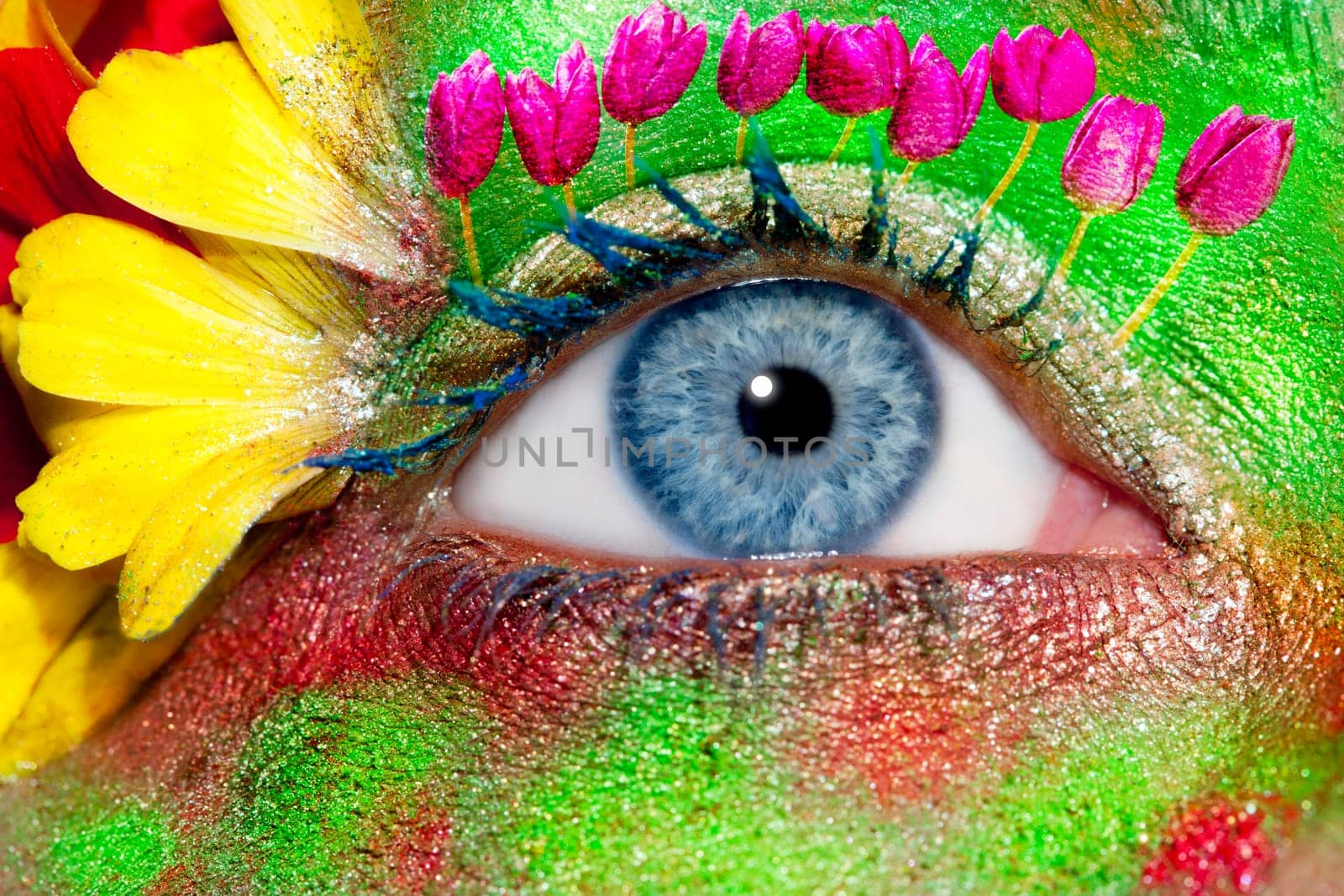 blue woman eye makeup inspired in spring with flowers meadow and yellow petals
